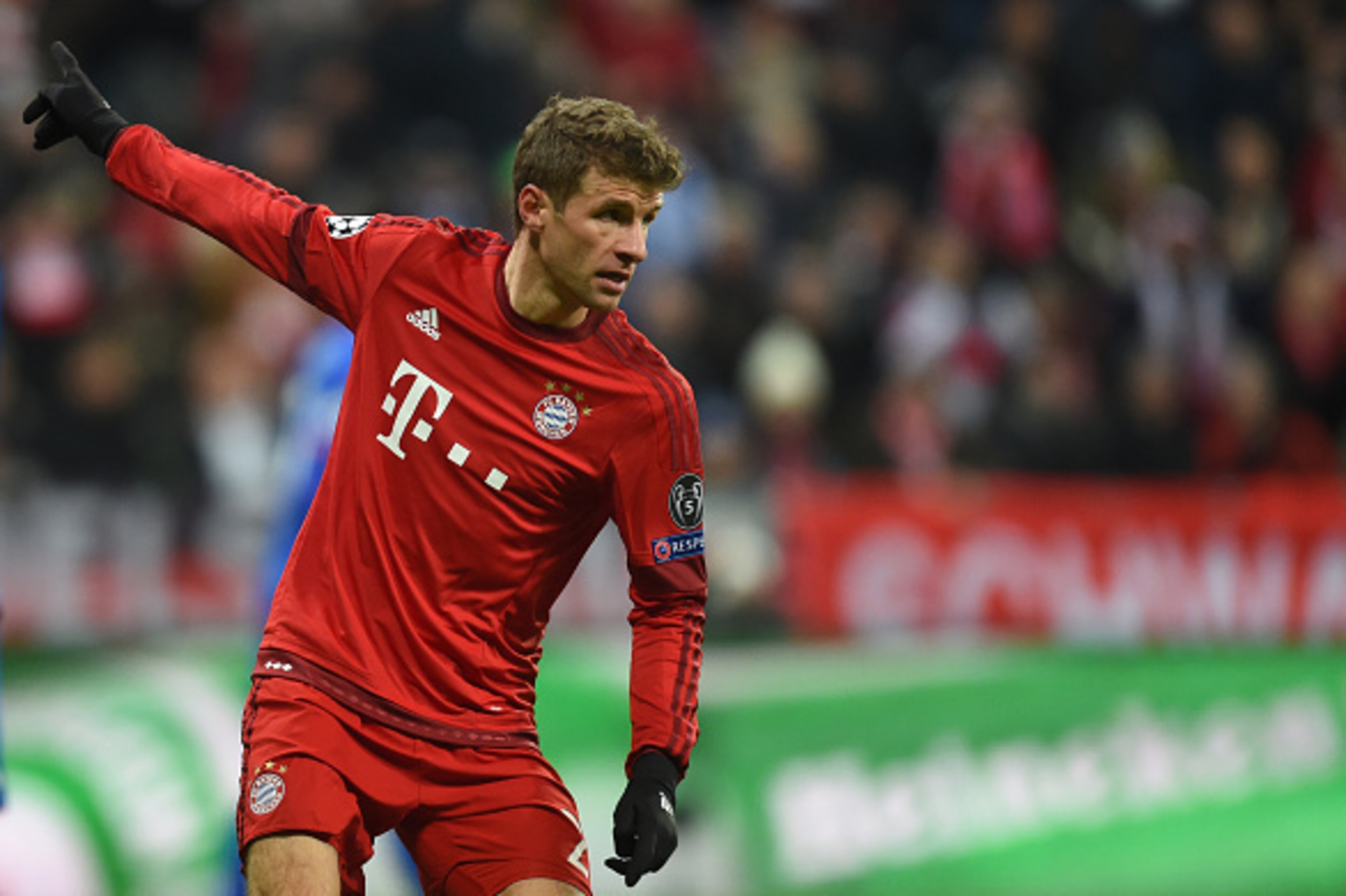 Bayern Munich's striker Thomas Mueller reacts after the third goal during the UEFA Champions League Group F football match between FCB Bayern Munich and Olympiakos Piraeus on November 24, 2015 at the 'Allianz Arena' in Munich, southern Germany. AFP PHOTO 