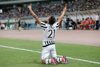 SHANGHAI, CHINA - AUGUST 08:  Paulo Dybala of Juventus FC in celebrates a goal during the Italian Super Cup final football match between Juventus and Lazio at Shanghai Stadium on August 8, 2015 in Shanghai, China.  (Photo by Lintao Zhang/Getty Images)