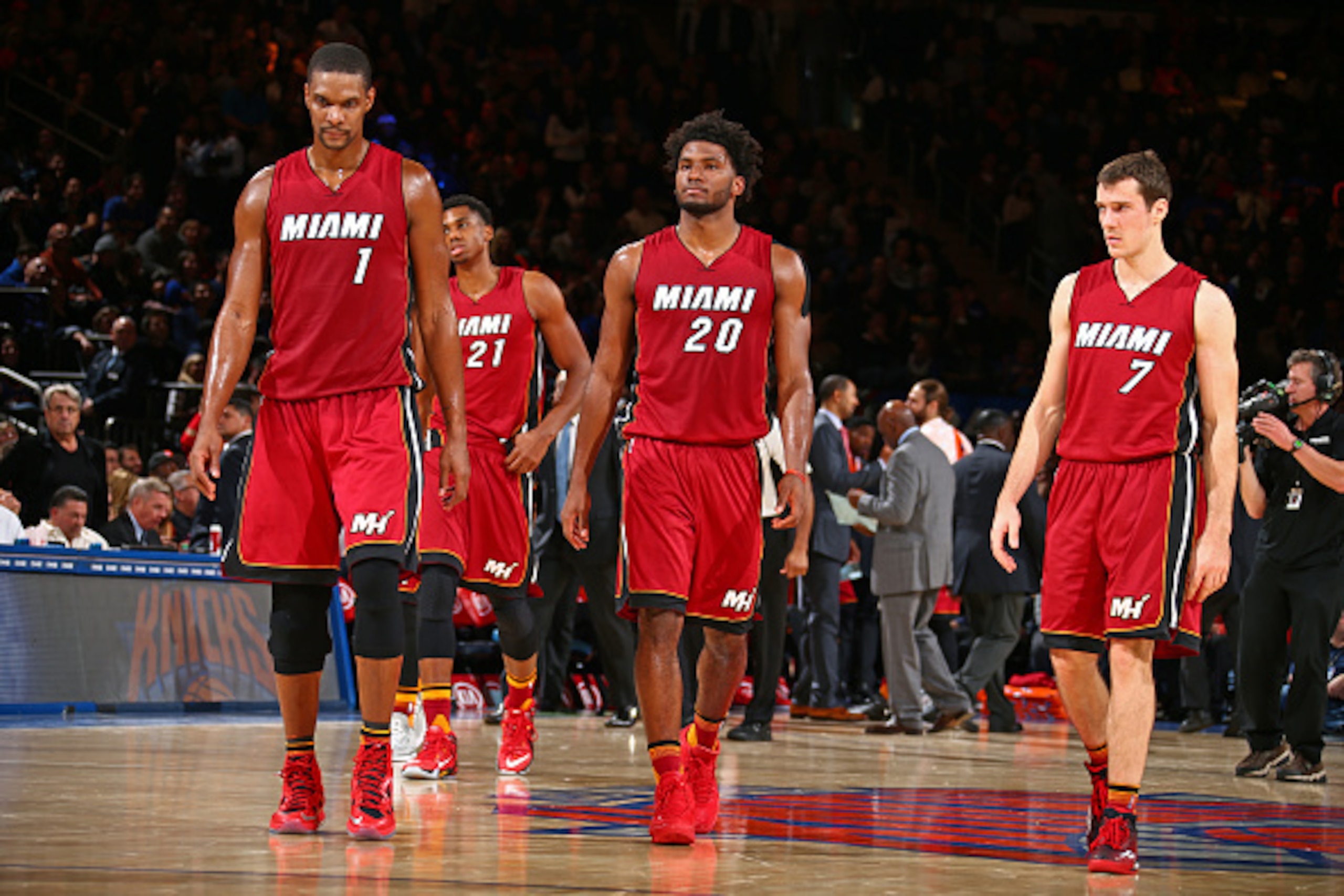 NEW YORK, NY - NOVEMBER 27:  Chris Bosh #1, Justise Winslow #20 and Goran Dragic #7 of the Miami Heat walk on the court during the game against the New York Knicks on November 27, 2015 at Madison Square Garden in New York City, New York.  NOTE TO USER: Us