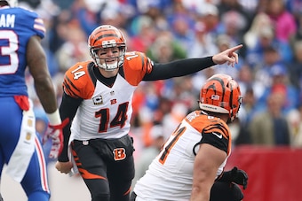 ORCHARD PARK, NY - OCTOBER 18:   Andy Dalton #14 of the Cincinnati Bengals calls an audible against the Buffalo Bills defense during the first half at Ralph Wilson Stadium on October 18, 2015 in Orchard Park, New York.  (Photo by Tom Szczerbowski/Getty Im