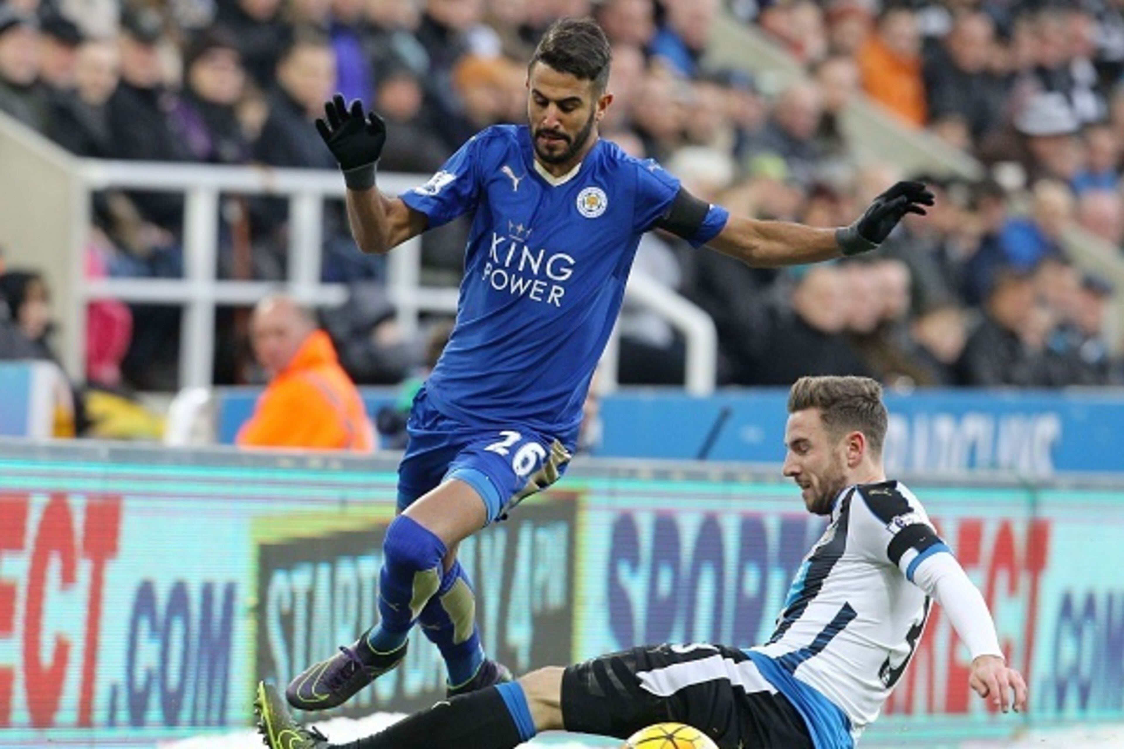 Newcastle United's Welsh defender Paul Dummett (R) challenges Leicester City's Algerian midfielder Riyad Mahrez during the English Premier League football match between Newcastle United and Leicester City at St James' Park in Newcastle-upon-Tyne, north ea