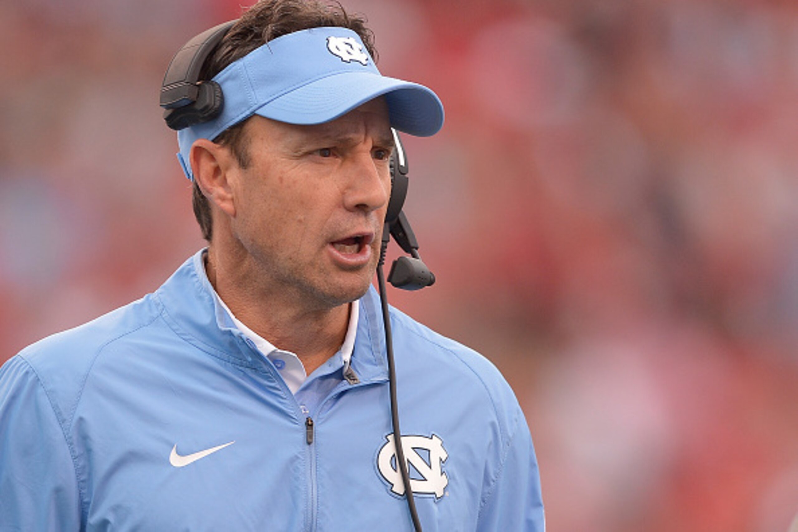 RALEIGH, NC - NOVEMBER 28:  Head coach Larry Fedora of the North Carolina Tar Heels  directs his team against the North Carolina State Wolfpack during their game at Carter-Finley Stadium on November 28, 2015 in Raleigh, North Carolina. North Carolina won 