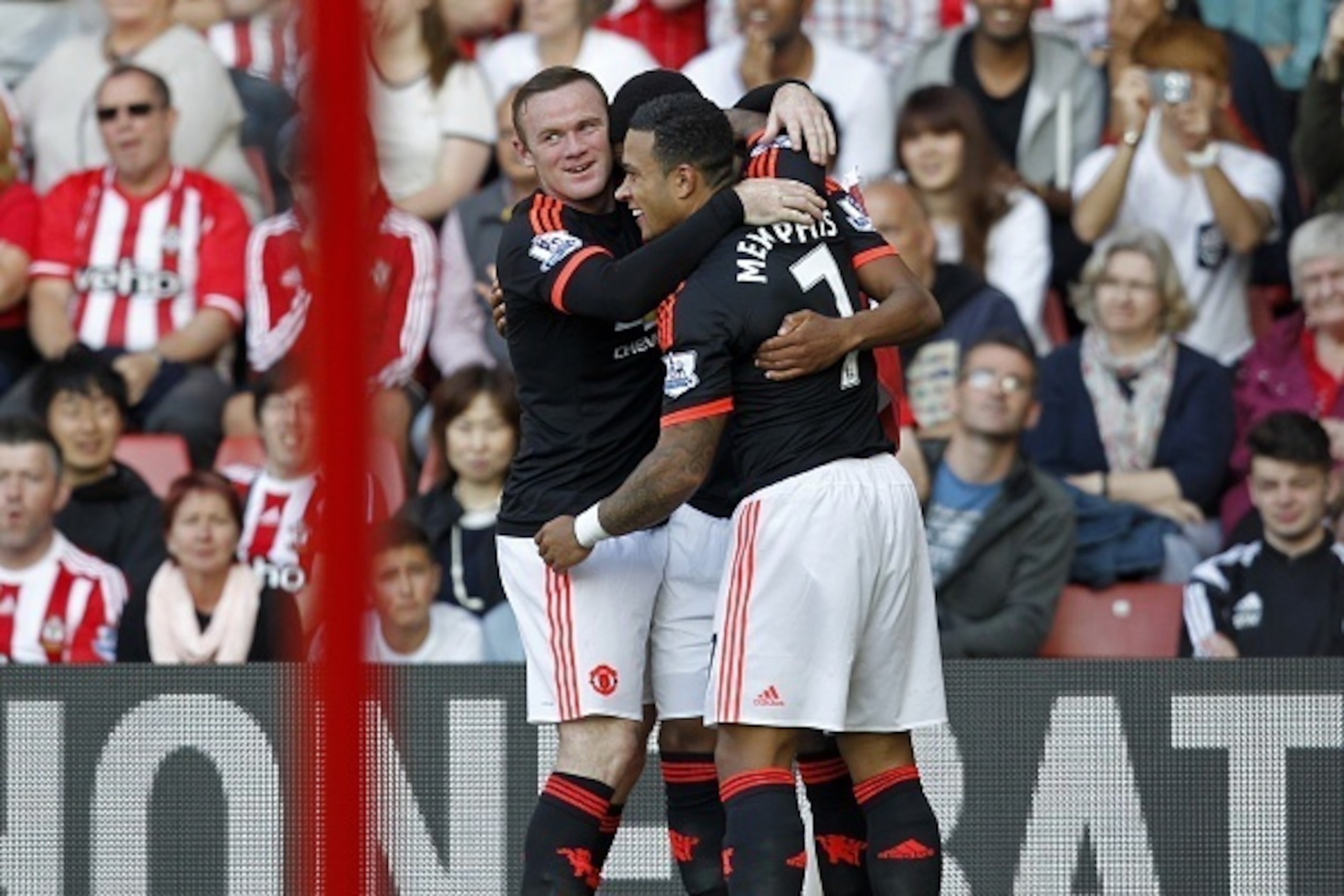 Manchester United's French striker Anthony Martial (C) celebrates with Manchester United's English striker Wayne Rooney and Manchester United's Dutch midfielder Memphis Depay (R) after scoring his second goal  during the English Premier League football ma