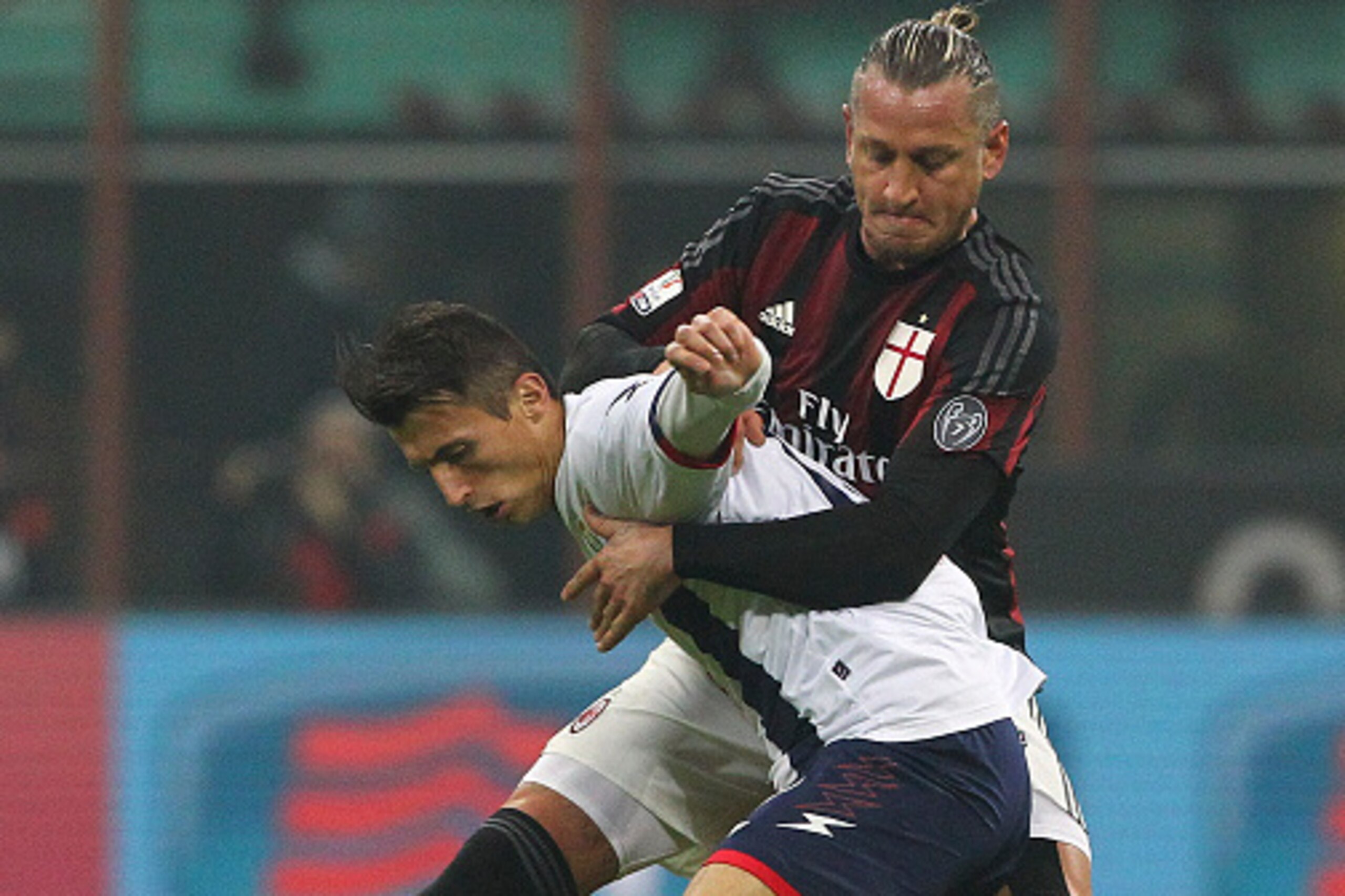MILAN, ITALY - DECEMBER 01:  Ante Budimir of FC Crotone competes for the ball with Philippe Mexes (back) of AC Milan during the TIM Cup match between AC Milan and FC Crotone at Stadio Giuseppe Meazza on December 1, 2015 in Milan, Italy.  (Photo by Marco L