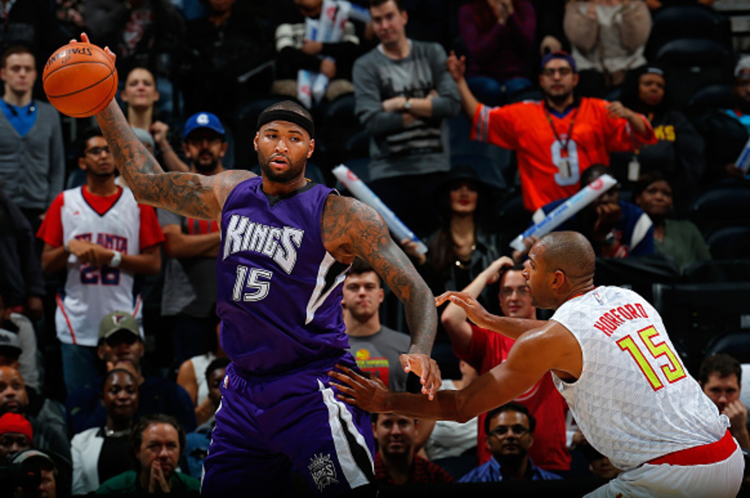 ATLANTA, GA - NOVEMBER 18:  Al Horford #15 of the Atlanta Hawks defends against DeMarcus Cousins #15 of the Sacramento Kings at Philips Arena on November 18, 2015 in Atlanta, Georgia.  NOTE TO USER User expressly acknowledges and agrees that, by downloadi