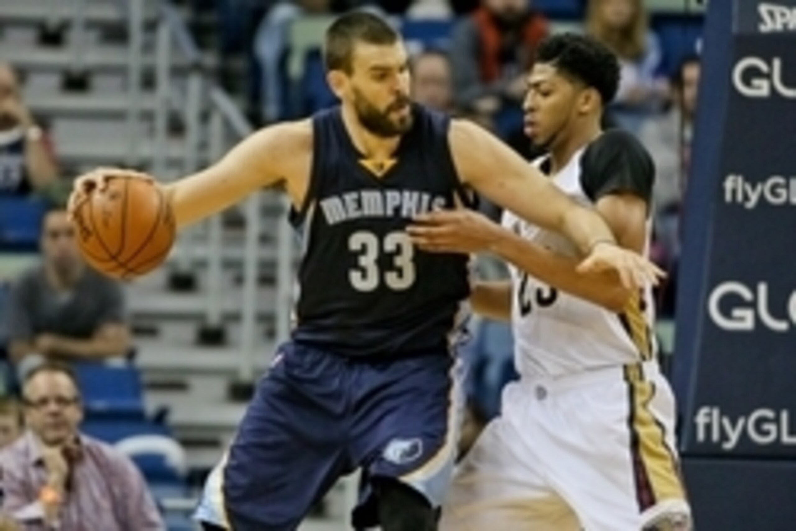 Dec 1, 2015; New Orleans, LA, USA; Memphis Grizzlies center Marc Gasol (33) is defended by New Orleans Pelicans forward Anthony Davis (23) during the second half of a game at the Smoothie King Center. The Grizzlies defeated the Pelicans 113-104. Mandatory