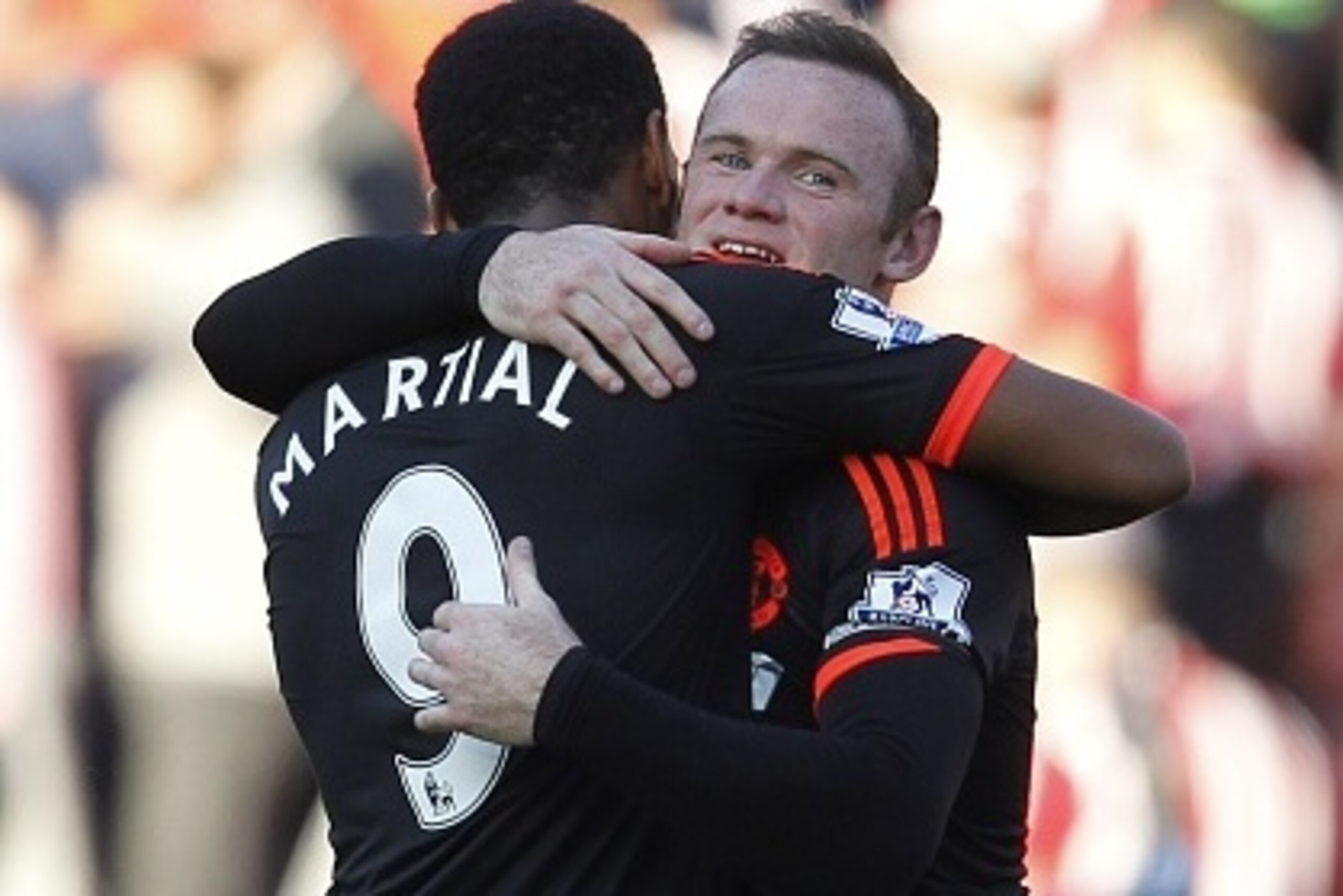 Manchester United's English striker Wayne Rooney embraces Manchester United's French striker Anthony Martial (L) after the English Premier League football match between Southampton and Manchester United at St Mary's Stadium in Southampton, southern Englan Manchester United's English striker Wayne Rooney embraces Manchester United's French striker Anthony Martial (L) after the English Premier League football match between Southampton and Manchester United at St Mary's Stadium in Southampton, southern Englan
