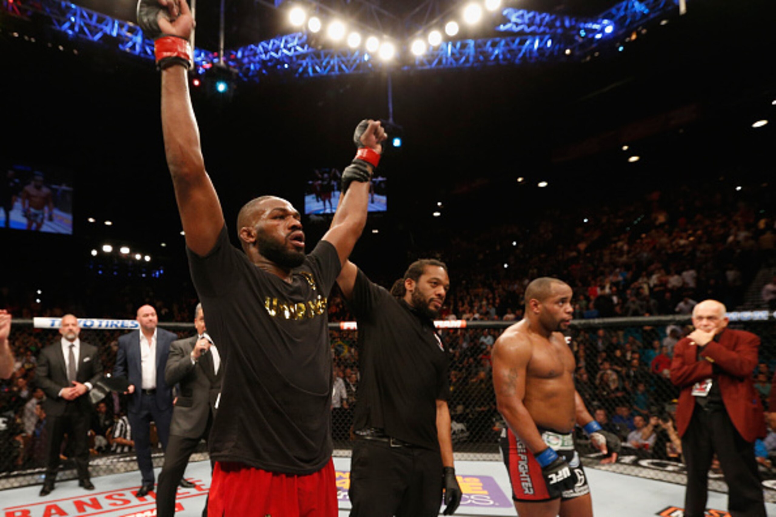 LAS VEGAS, NV - JANUARY 03: UFC light heavyweight champion Jon Jones (L) celebrates his win over Daniel Cormier (R) in their UFC light heavyweight championship bout during the UFC 182 event at the MGM Grand Garden Arena on January 3, 2015 in Las Vegas, N LAS VEGAS, NV - JANUARY 03: UFC light heavyweight champion Jon Jones (L) celebrates his win over Daniel Cormier (R) in their UFC light heavyweight championship bout during the UFC 182 event at the MGM Grand Garden Arena on January 3, 2015 in Las Vegas, N