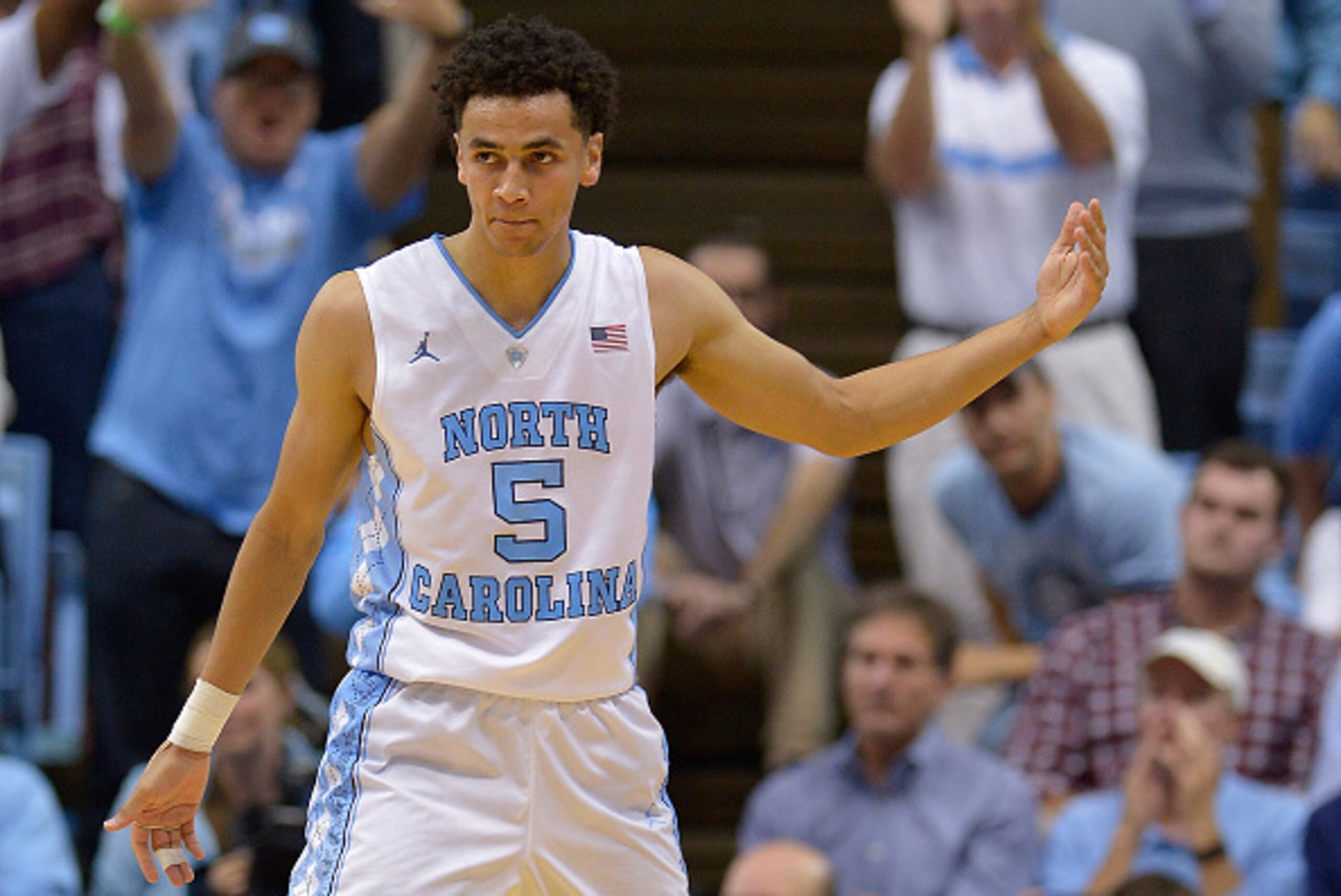 CHAPEL HILL, NC - DECEMBER 01:  Marcus Paige #5 of the North Carolina Tar Heels encourages the crowd to stand and cheer during their game against the Maryland Terrapins at the Dean Smith Center on December 1, 2015 in Chapel Hill, North Carolina. North Car