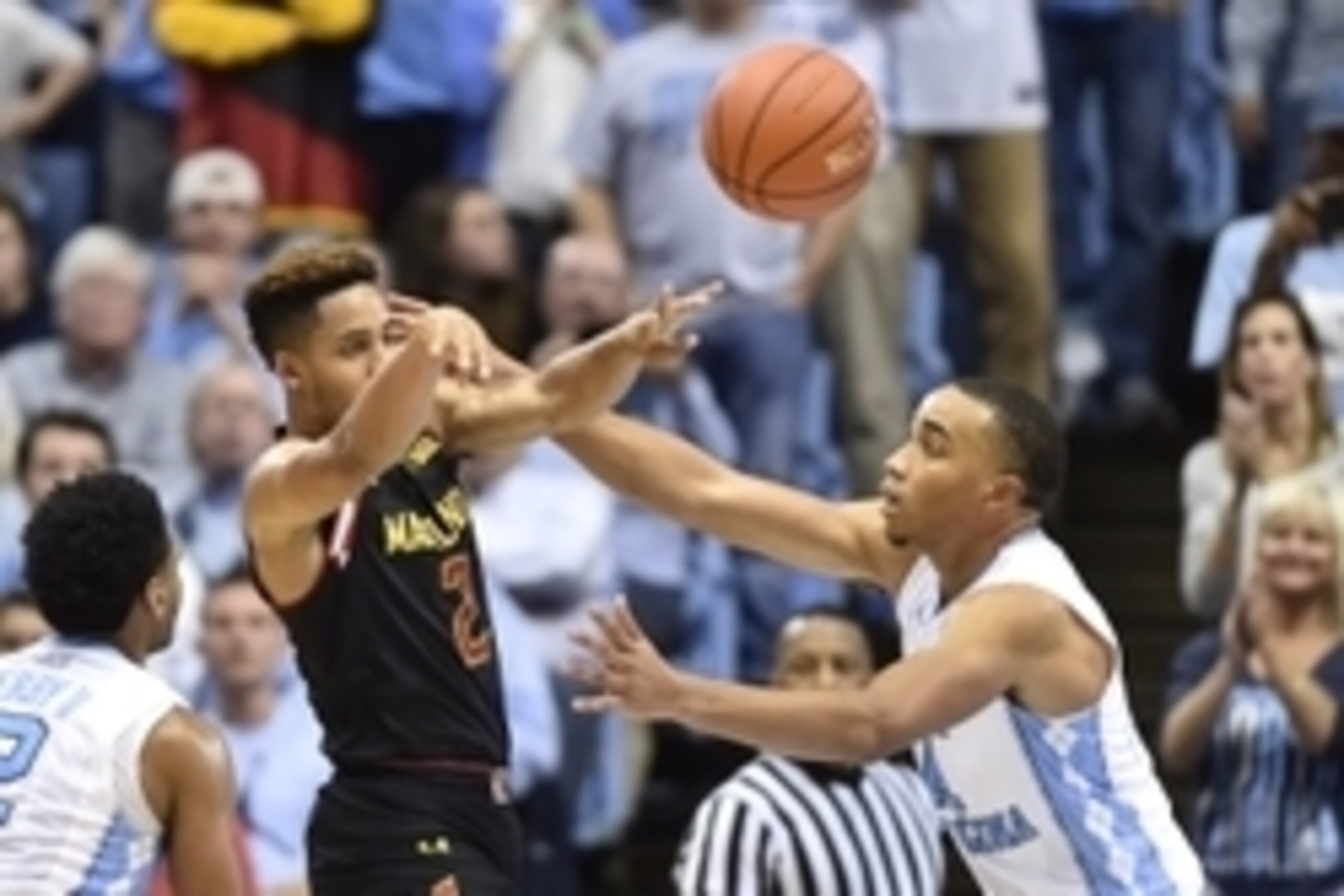 Dec 1, 2015; Chapel Hill, NC, USA; Maryland Terrapins guard Melo Trimble (2) passes the ball as North Carolina Tar Heels forward Brice Johnson (11) defends in the second half. The Tar Heels defeated the Terrapins 89-81 at Dean E. Smith Center. Mandatory C