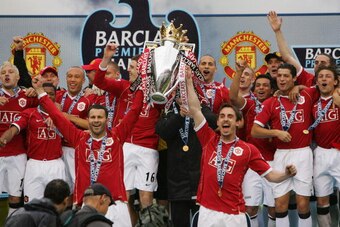 MANCHESTER, UNITED KINGDOM - MAY 13:  Ryan Giggs (L) and Gary Neville of Manchester United lift the Premiership trophy as their team celebrate winning the Premiership title at the end of the Barclays Premiership match between Manchester United and West Ha