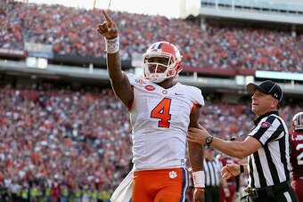 COLUMBIA, SC - NOVEMBER 28:  Deshaun Watson #4 of the Clemson Tigers after scoring a touchdown during their game against the South Carolina Gamecocks at Williams-Brice Stadium on November 28, 2015 in Columbia, South Carolina.  (Photo by Streeter Lecka/Get