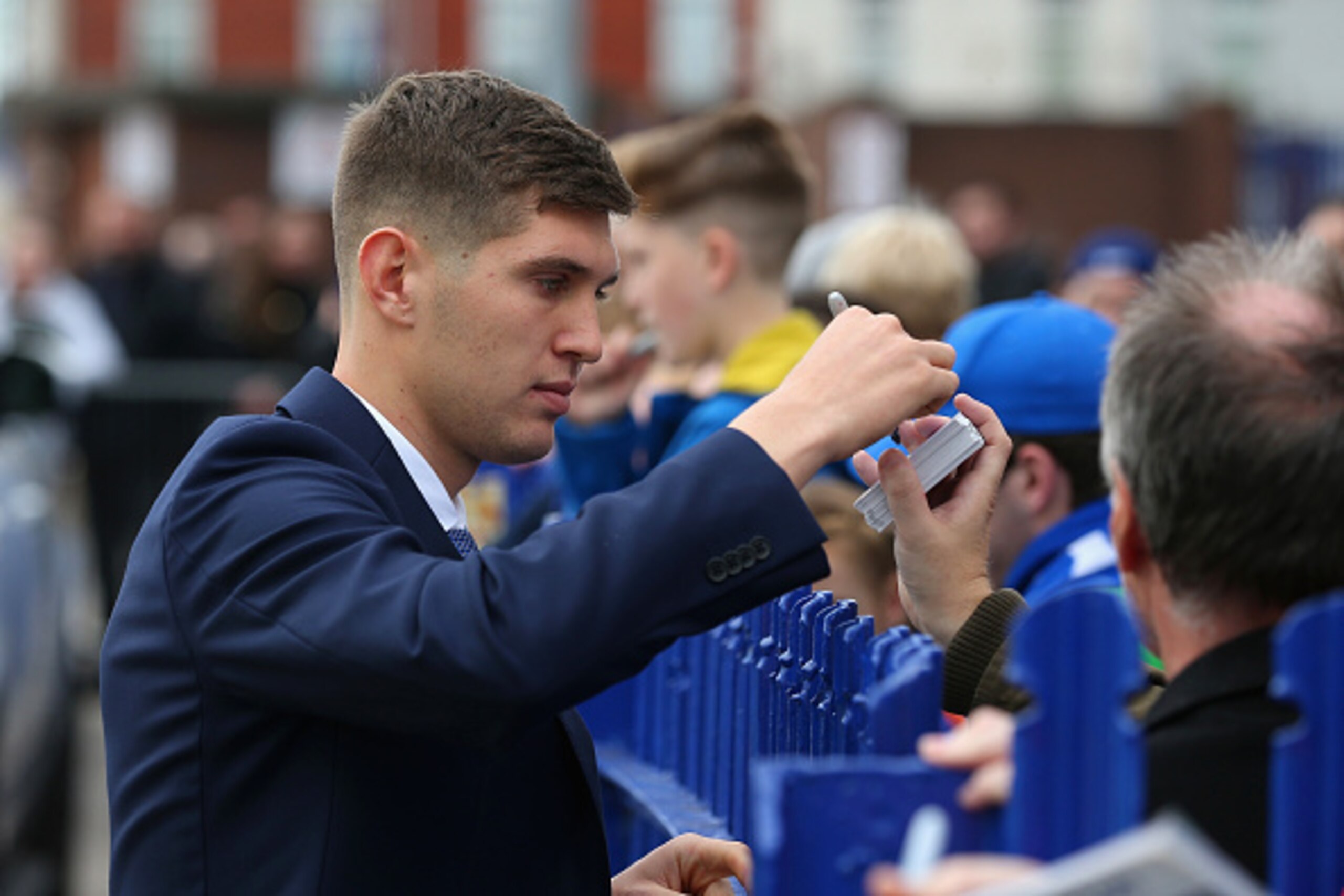 LIVERPOOL, ENGLAND - OCTOBER 17:  John Stones of Everton signs autographs for fans prior to the Barclays Premier League match between Everton and Manchester United at Goodison Park on October 17, 2015 in Liverpool, England.  (Photo by Chris Brunskill/Gett