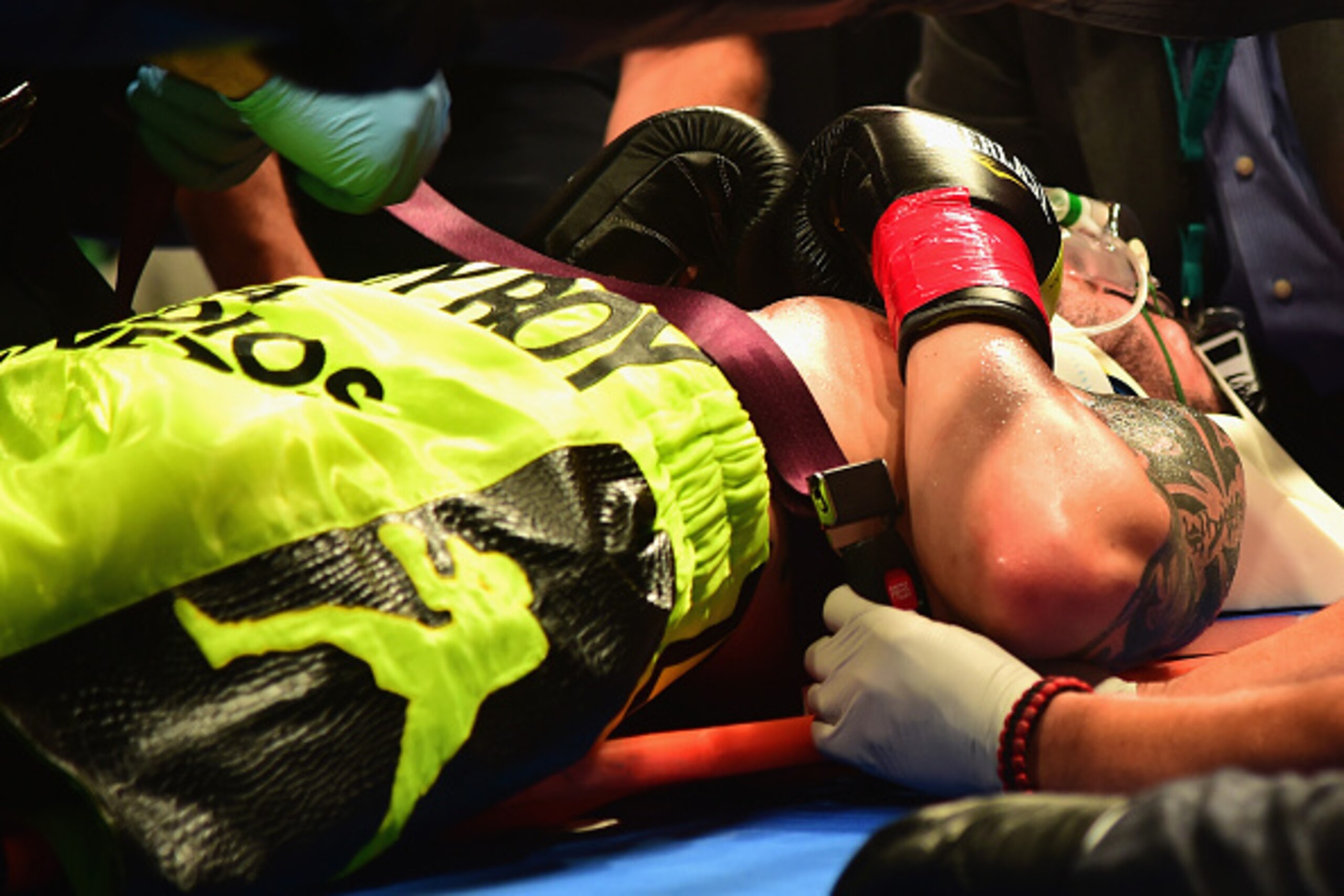 MASHANTUCKET, CT - SEPTEMBER 12: Michael Zerafa is put onto a stretcher after being knocked out by Peter Quillin during a fight at Foxwoods Resort Casino on September 12, 2015 in Mashantucket, Connecticut.  (Photo by Billie Weiss/Getty Images)