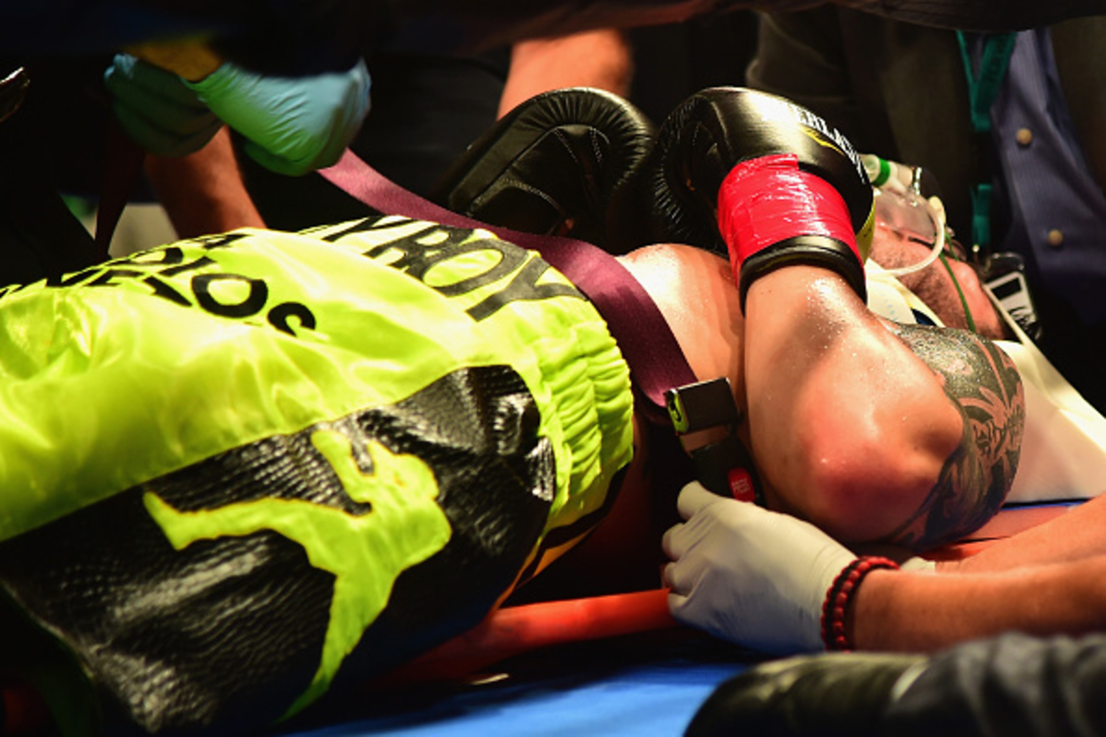 MASHANTUCKET, CT - SEPTEMBER 12: Michael Zerafa is put onto a stretcher after being knocked out by Peter Quillin during a fight at Foxwoods Resort Casino on September 12, 2015 in Mashantucket, Connecticut.  (Photo by Billie Weiss/Getty Images)