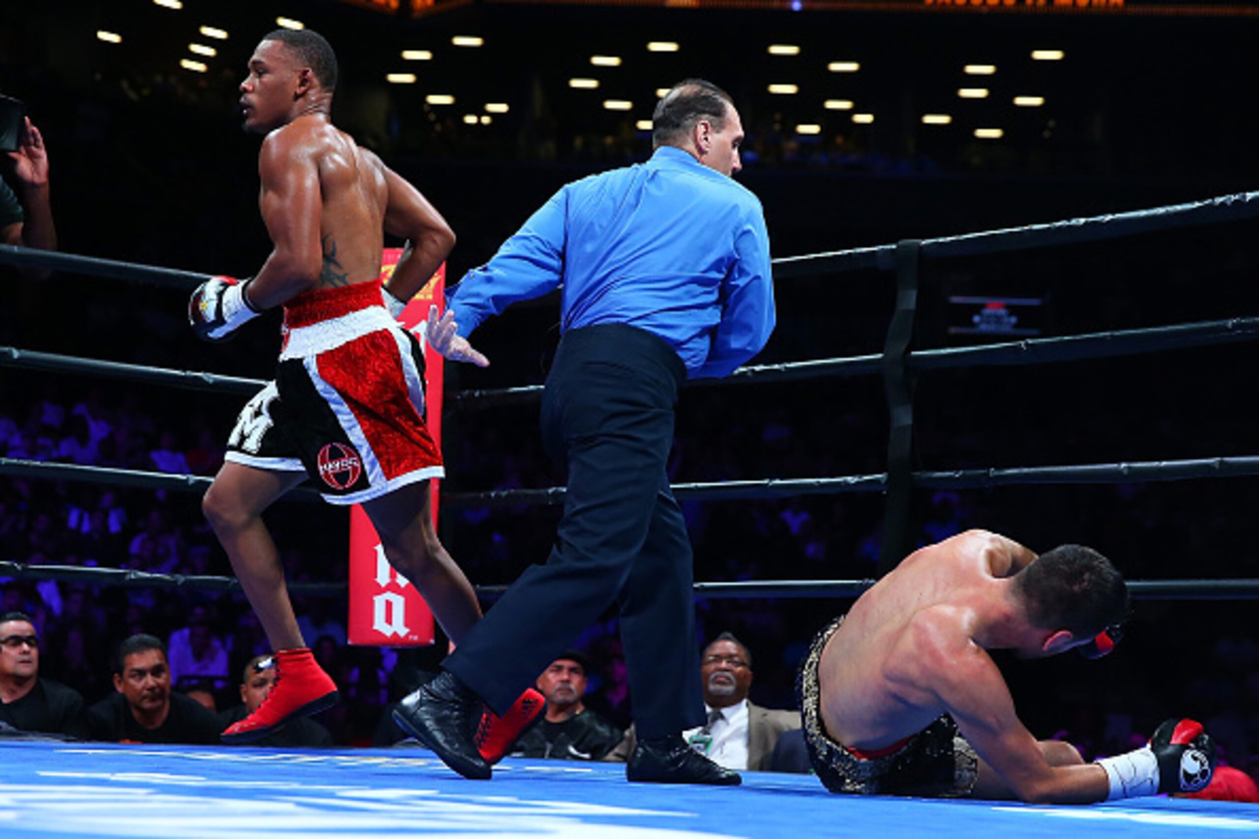 NEW YORK, NY - AUGUST 01:  Danny Jacobs (L) knocksdown Sergio Mora in the second round during their middleweight bout at Barclays Center on August 1, 2015 in Brooklyn borough of New York City.  (Photo by Mike Stobe/Getty Images)