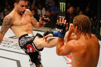 MANILA, PHILIPPINES - MAY 16: Frankie Edgar of the United States throws a kick at Uriah Faber of the United States in their featherweight fight during the UFC Fight Night event at the Mall of Asia Arena on May 16, 2015 in Manila, Philippines. (Photo by Mi