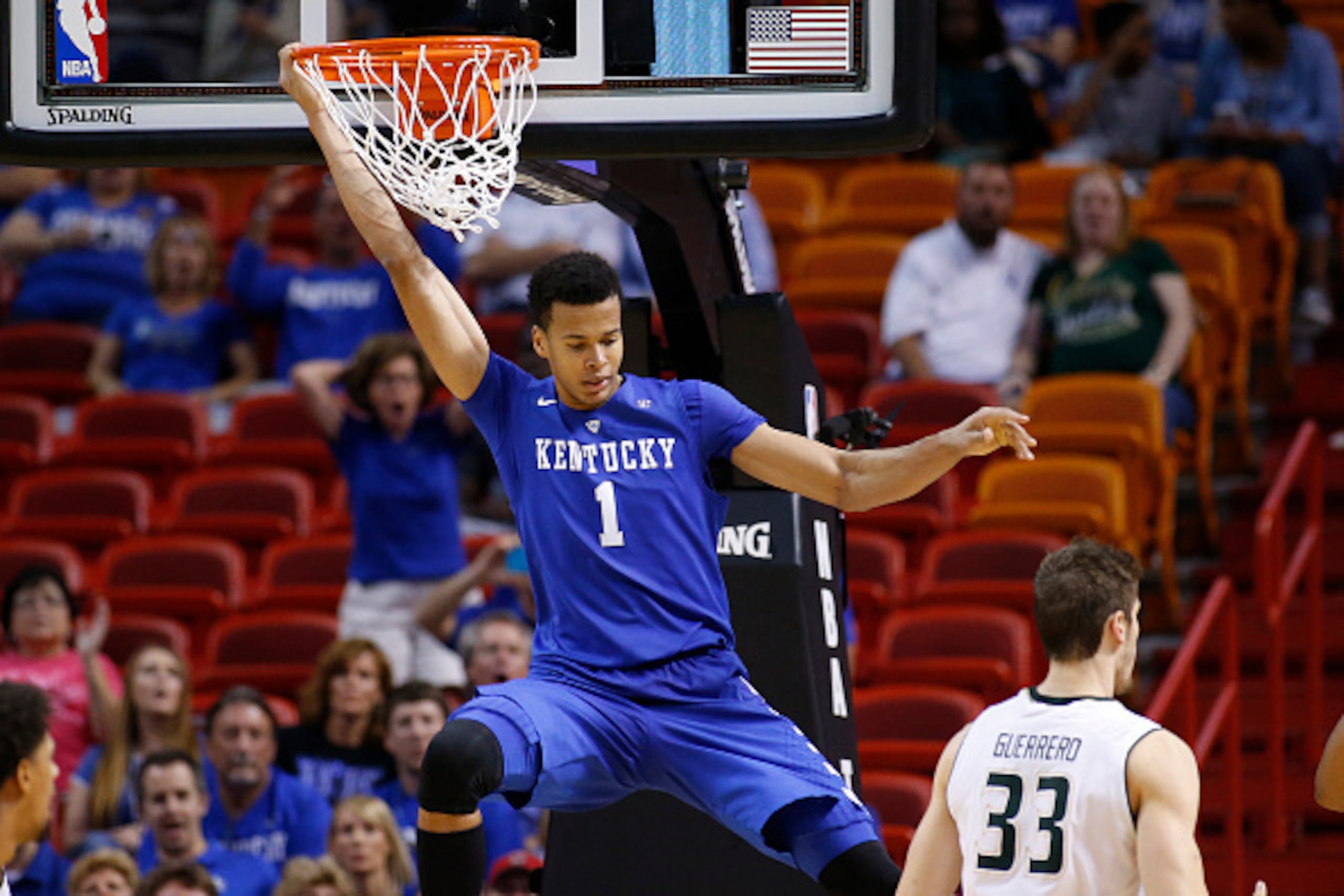 MIAMI, FL - NOVEMBER 27: Skal Labissiere of the Kentucky Wildcats hangs on the basket after being fouled on the way up by the South Florida Bulls on November 27, 2015 at the American Airlines Arena in Miami, Florida. Kentucky defeated South Florida 84-63. MIAMI, FL - NOVEMBER 27: Skal Labissiere of the Kentucky Wildcats hangs on the basket after being fouled on the way up by the South Florida Bulls on November 27, 2015 at the American Airlines Arena in Miami, Florida. Kentucky defeated South Florida 84-63.
