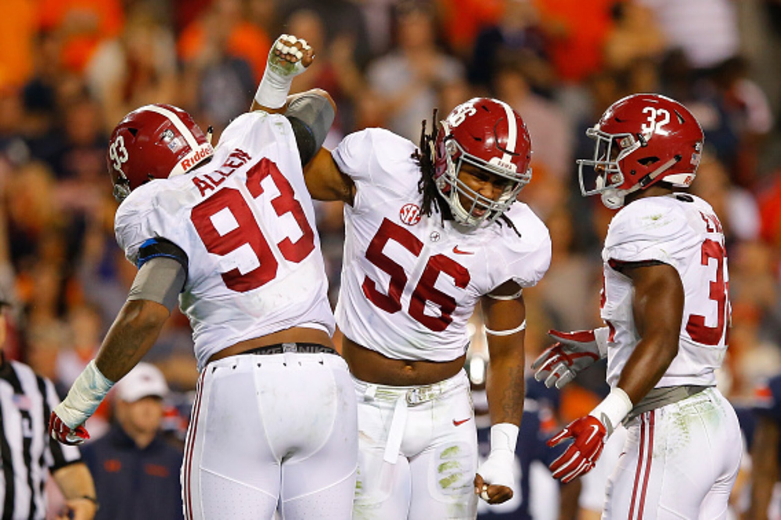 AUBURN, AL - NOVEMBER 28:  Jonathan Allen #93, Tim Williams #56 and Rashaan Evans #32 of the Alabama Crimson Tide react after a defensive stop against the Auburn Tigers at Jordan Hare Stadium on November 28, 2015 in Auburn, Alabama.  (Photo by Kevin C. Co