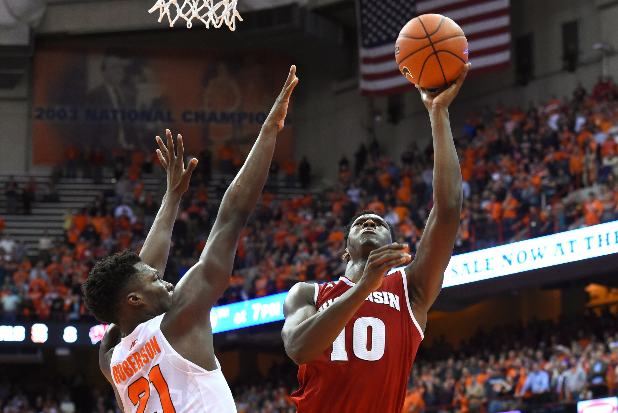 Dec 2, 2015; Syracuse, NY, USA; Wisconsin Badgers forward Nigel Hayes (10) shoots the ball as Syracuse Orange forward Tyler Roberson (21) defends during overtime at the Carrier Dome.  Wisconsin defeated Syracuse 66-58.  Mandatory Credit: Rich Barnes-USA T