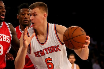 NEW YORK, NY - DECEMBER 02:  Kristaps Porzingis #6 of the New York Knicks heads for the net as JaKarr Sampson #9 of the Philadelphia 76ers defends at Madison Square Garden on December 2, 2015 in New York City.The New York Knicks defeated the Philadelphia 