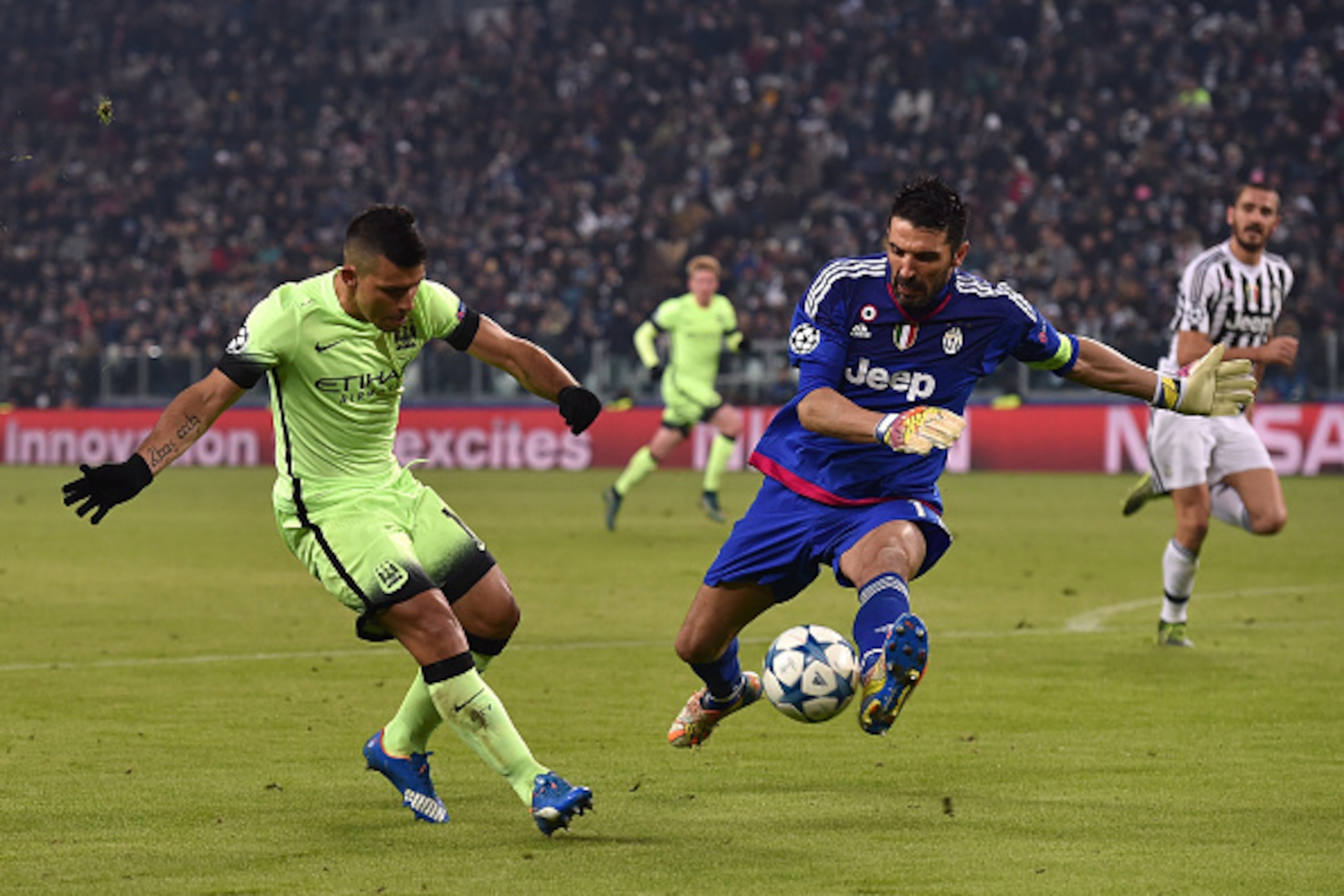 TURIN, ITALY - NOVEMBER 25: Sergio Aguero (L) of Manchester City FC in action against Gianluigi Buffon of Juventus during the UEFA Champions League group stage match between Juventus and Manchester City FC at Juventus Arena on November 25, 2015 in Turin, TURIN, ITALY - NOVEMBER 25: Sergio Aguero (L) of Manchester City FC in action against Gianluigi Buffon of Juventus during the UEFA Champions League group stage match between Juventus and Manchester City FC at Juventus Arena on November 25, 2015 in Turin,