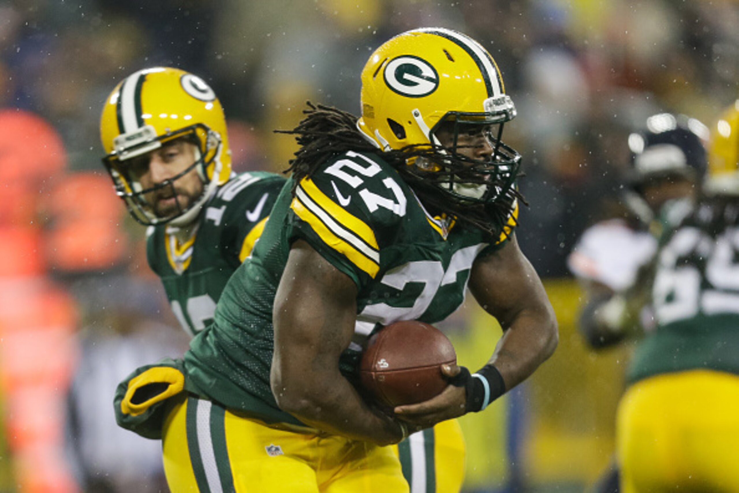 GREEN BAY, WI - NOVEMBER 26:   Eddie Lacy #27 of the Green Bay Packers receives the football from quarterback  Aaron Rodgers #12 in the first quarter against the Chicago Bears at Lambeau Field on November 26, 2015 in Green Bay, Wisconsin.  (Photo by Mike 
