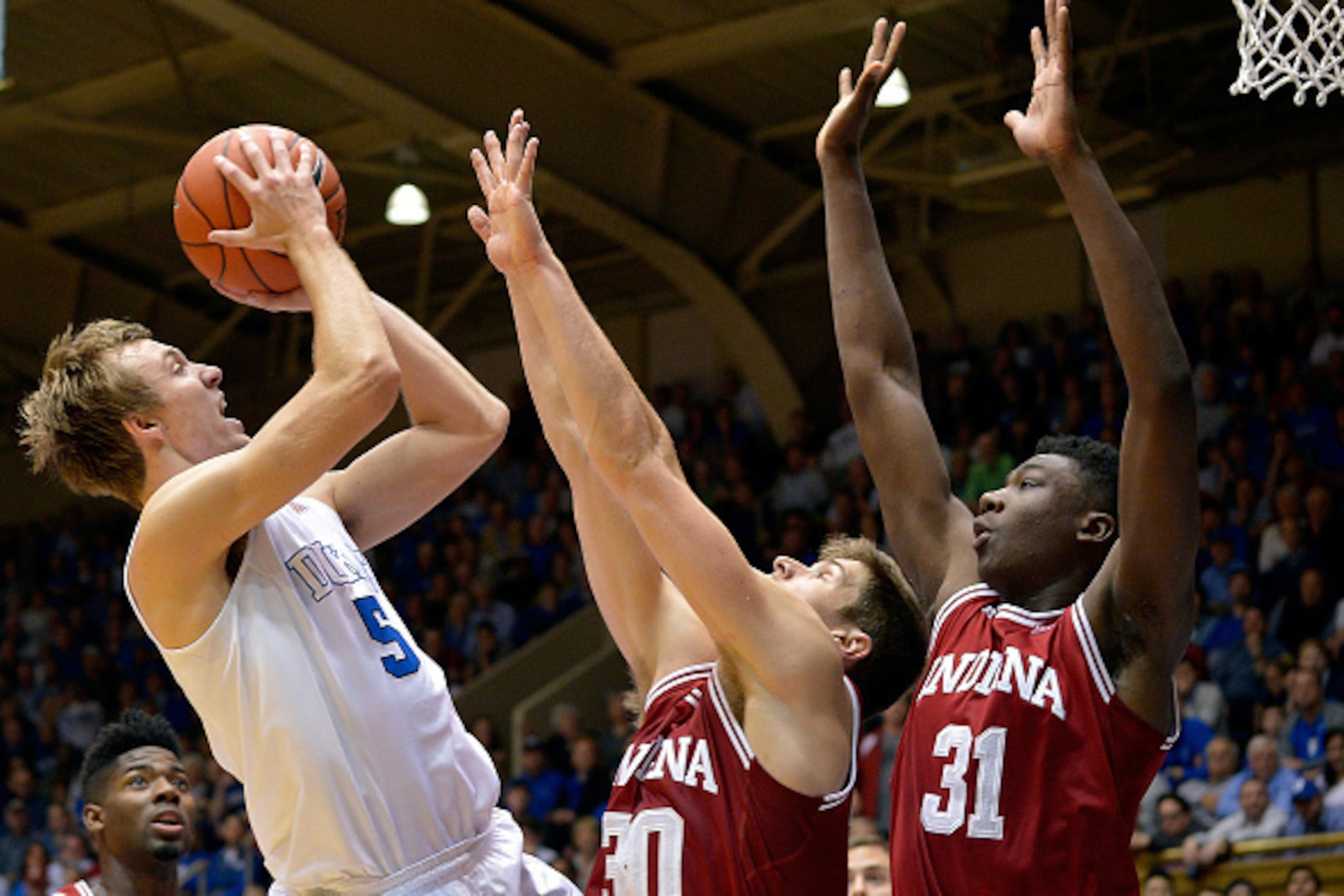 DURHAM, NC - DECEMBER 02: Luke Kennard #5 of the Duke Blue Devils shoots against Collin Hartman #30 and Thomas Bryant #31 of the Indiana Hoosiers during their game at Cameron Indoor Stadium on December 2, 2015 in Durham, North Carolina. (Photo by Grant DURHAM, NC - DECEMBER 02: Luke Kennard #5 of the Duke Blue Devils shoots against Collin Hartman #30 and Thomas Bryant #31 of the Indiana Hoosiers during their game at Cameron Indoor Stadium on December 2, 2015 in Durham, North Carolina. (Photo by Grant