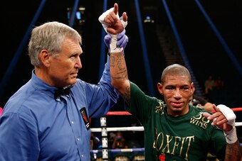 LAS VEGAS, NV - SEPTEMBER 12:  Ashley Theophane (r) has his arm lifted by referee Jay Nady after defeating Steven Upsher in their junior welterweight fight at MGM Grand Garden Arena on September 12, 2015 in Las Vegas, Nevada.  (Photo by Ezra Shaw/Getty Im