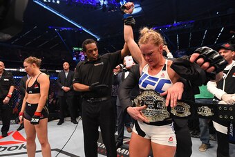 MELBOURNE, AUSTRALIA - NOVEMBER 15:  Holly Holm of the United States celebrates after her knockout victory over Ronda Rousey of the United States in their UFC women's bantamweight championship bout during the UFC 193 event at Etihad Stadium on November 15