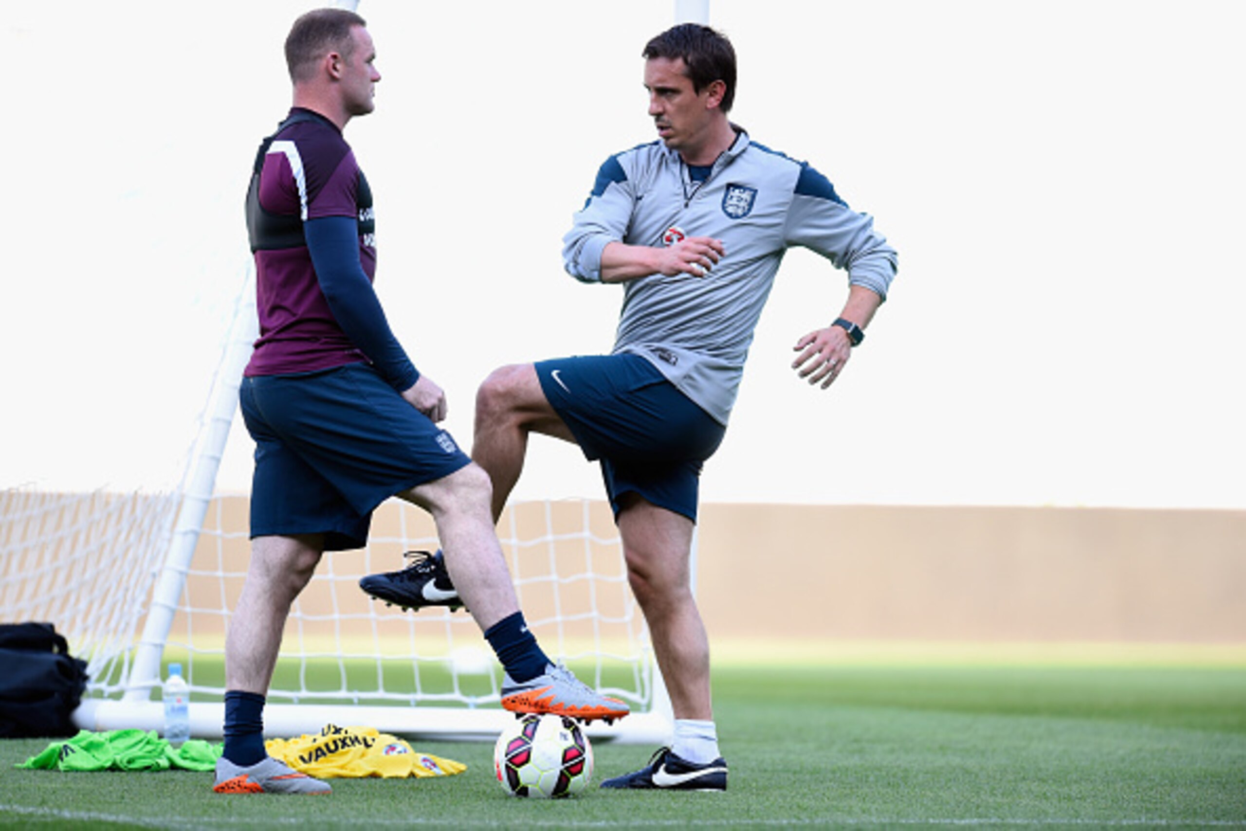 LJUBLJANA, SLOVENIA - JUNE 13: England captain Wayne Rooney (l) chats with coach Gary Neville during England Training ahead of sunday's UEFA EURO 2016 Qualifier between Slovenia and England at Stozice on June 13, 2015 in Ljubljana, Slovenia. (Photo by LJUBLJANA, SLOVENIA - JUNE 13: England captain Wayne Rooney (l) chats with coach Gary Neville during England Training ahead of sunday's UEFA EURO 2016 Qualifier between Slovenia and England at Stozice on June 13, 2015 in Ljubljana, Slovenia. (Photo by