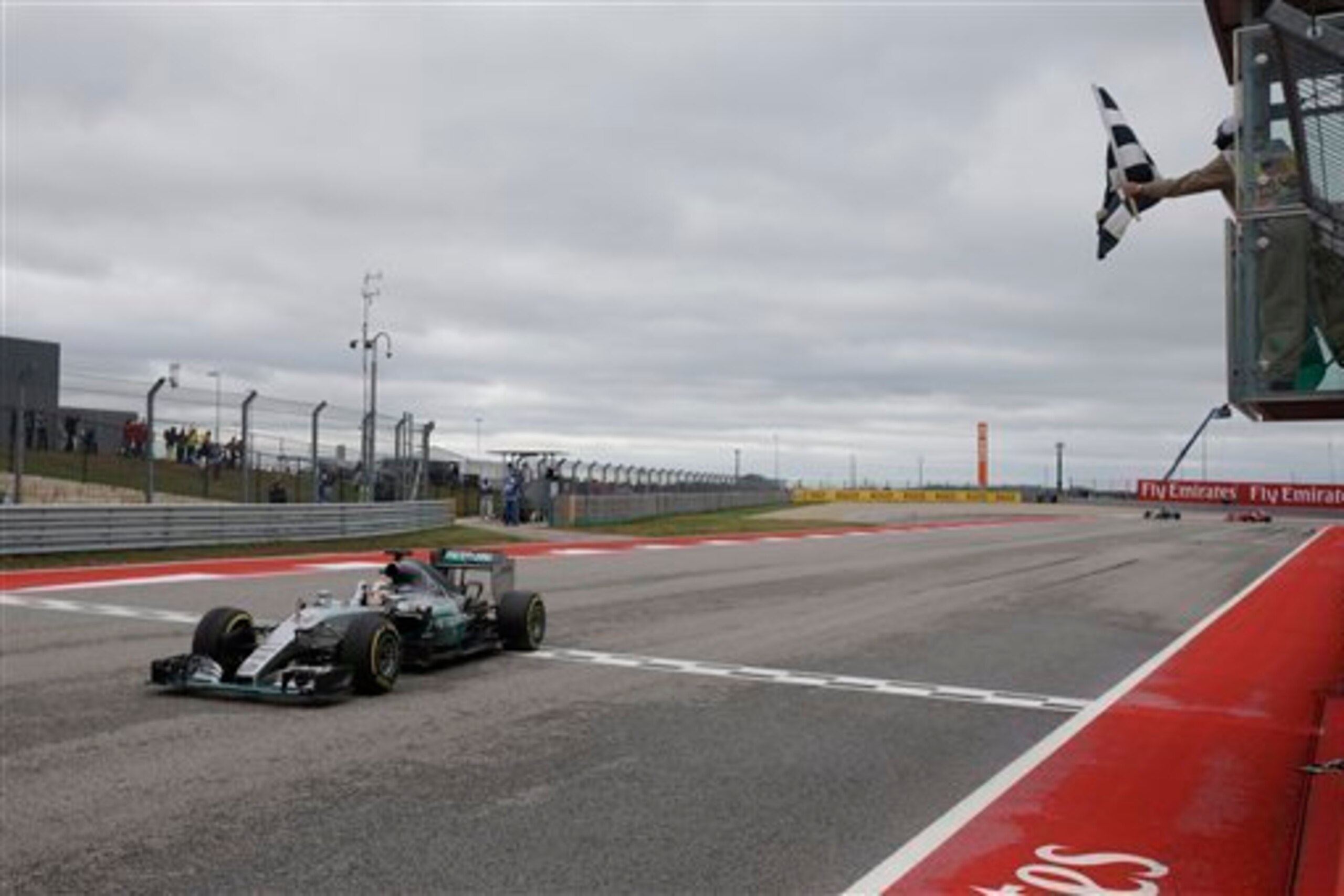 Lewis Hamilton crosses the line to win his third world title.