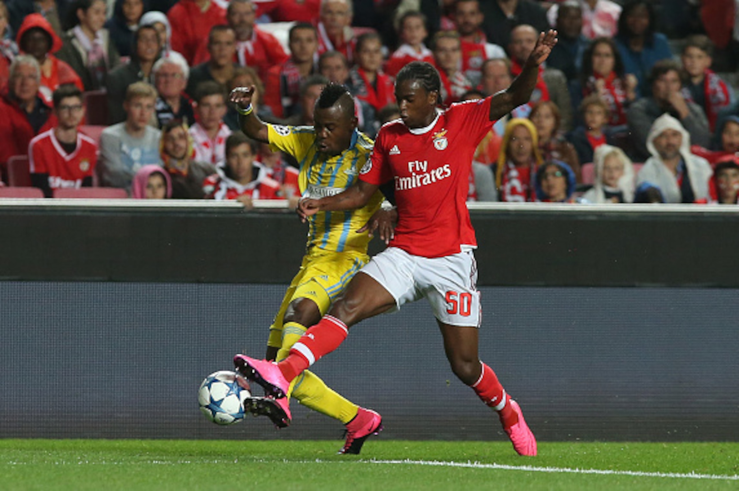 LISBON, PORTUGAL - SEPTEMBER 15:  FC Astana's forward Patrick Twumasi with SL Benfica's defender Nelson Semedo in action during the UEFA Champions League match between SL Benfica and FC Astana at Estadio da Luz on September 15, 2015 in Lisbon, Portugal.  