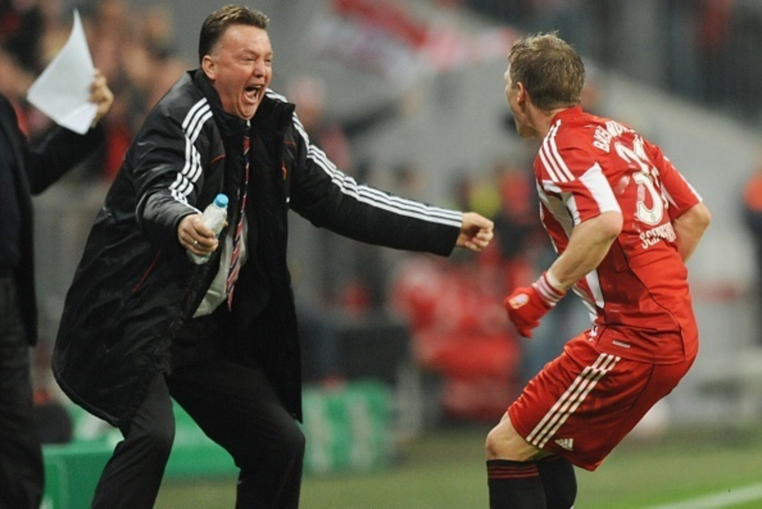 (FILES) - Picture taken on October 26, 2010 shows Bayern Munich's midfielder Bastian Schweinsteiger (R) celebrating scoring with Bayern Munich's Dutch head coach Louis van Gaal during the DFB German Cup football match FC Bayern Munich vs Werder Bremen in 