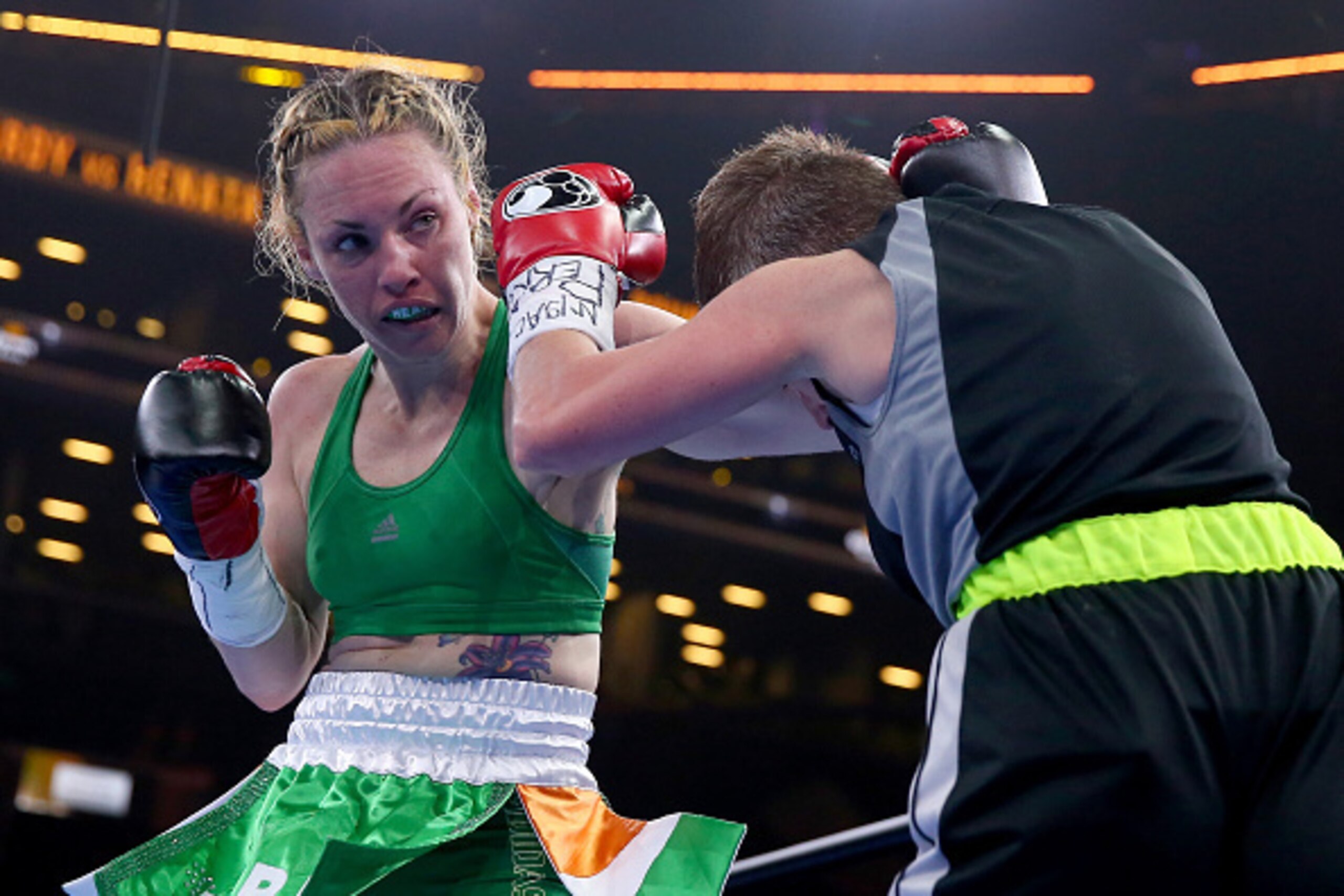 NEW YORK, NY - APRIL 11:  Heather Hardy and Renata Domsodi exchanges punches during the Premier Boxing Champions Junior Featherweight bout at Barclays Center on April 11, 2015 in the Brooklyn borough of New York City.  (Photo by Elsa/Getty Images)