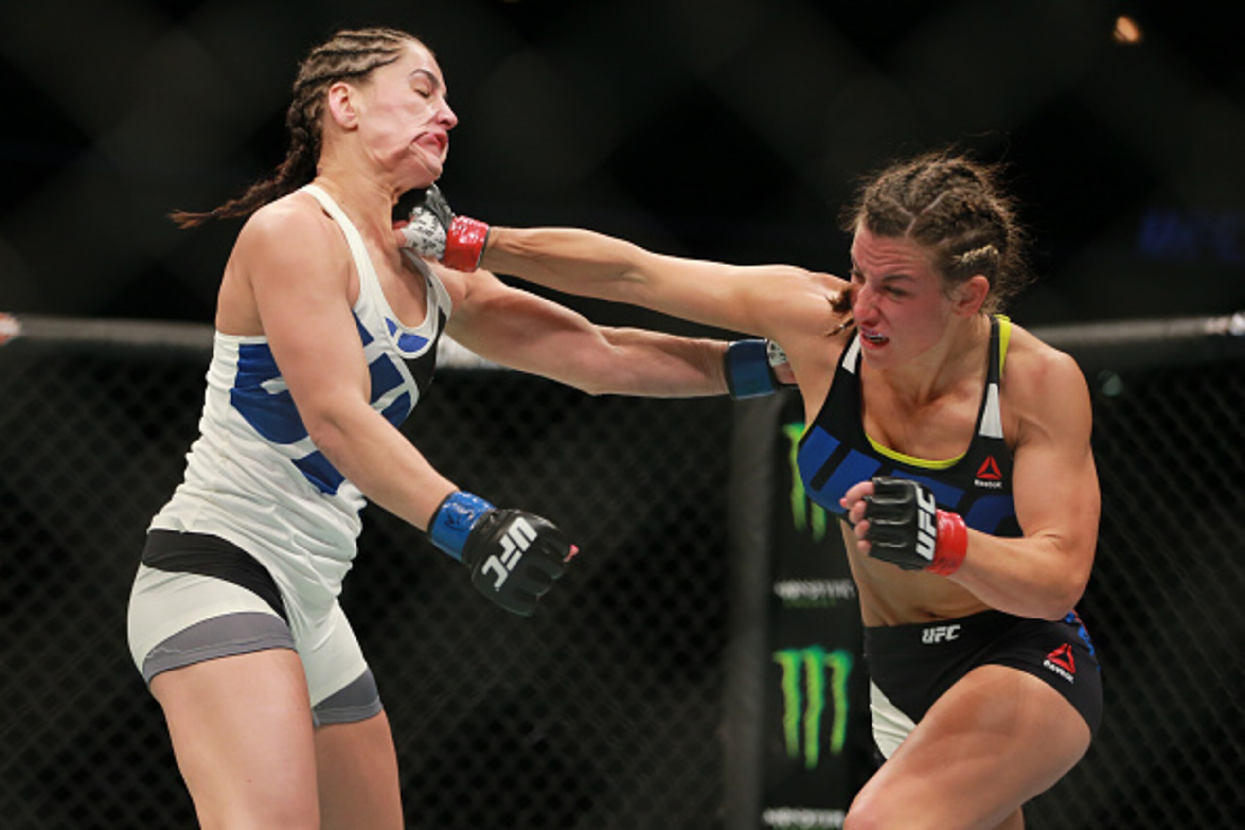 CHICAGO, IL - JULY 25:  Miesha Tate punches Jessica Eye in their women's bantamweight bout during the UFC event at the United Center on July 25, 2015 in Chicago, Illinois. (Photo by Rey Del Rio/Zuffa LLC/Zuffa LLC via Getty Images)