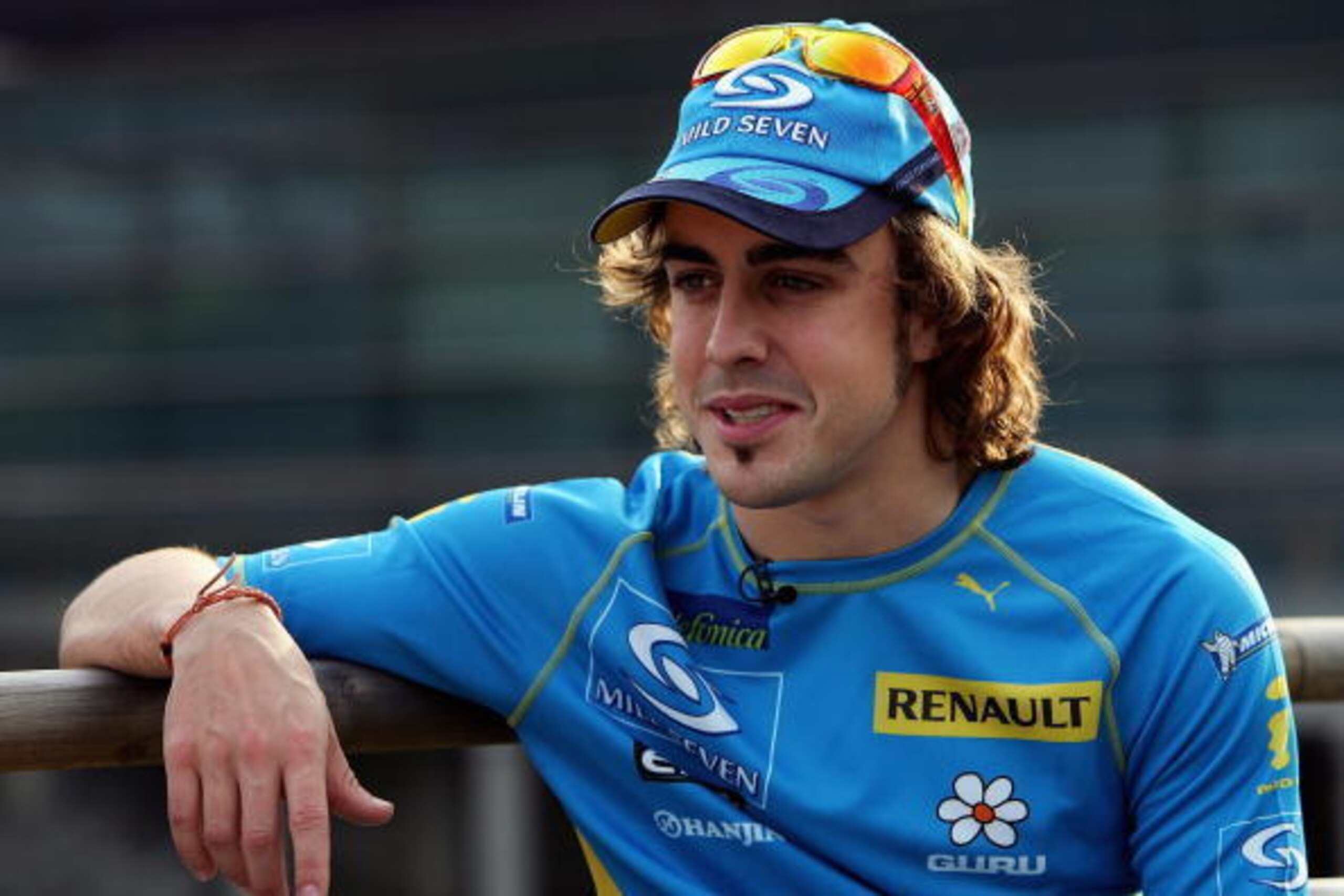 SHANGHAI, CHINA - OCTOBER 15:  Fernando Alonso of Spain and Renault looks on in the paddock following qualifying for the Chinese F1 Grand Prix at the Shanghai International Circuit on October 15, 2005, in Shanghai, China.  (Photo by Mark Thompson/Getty Im