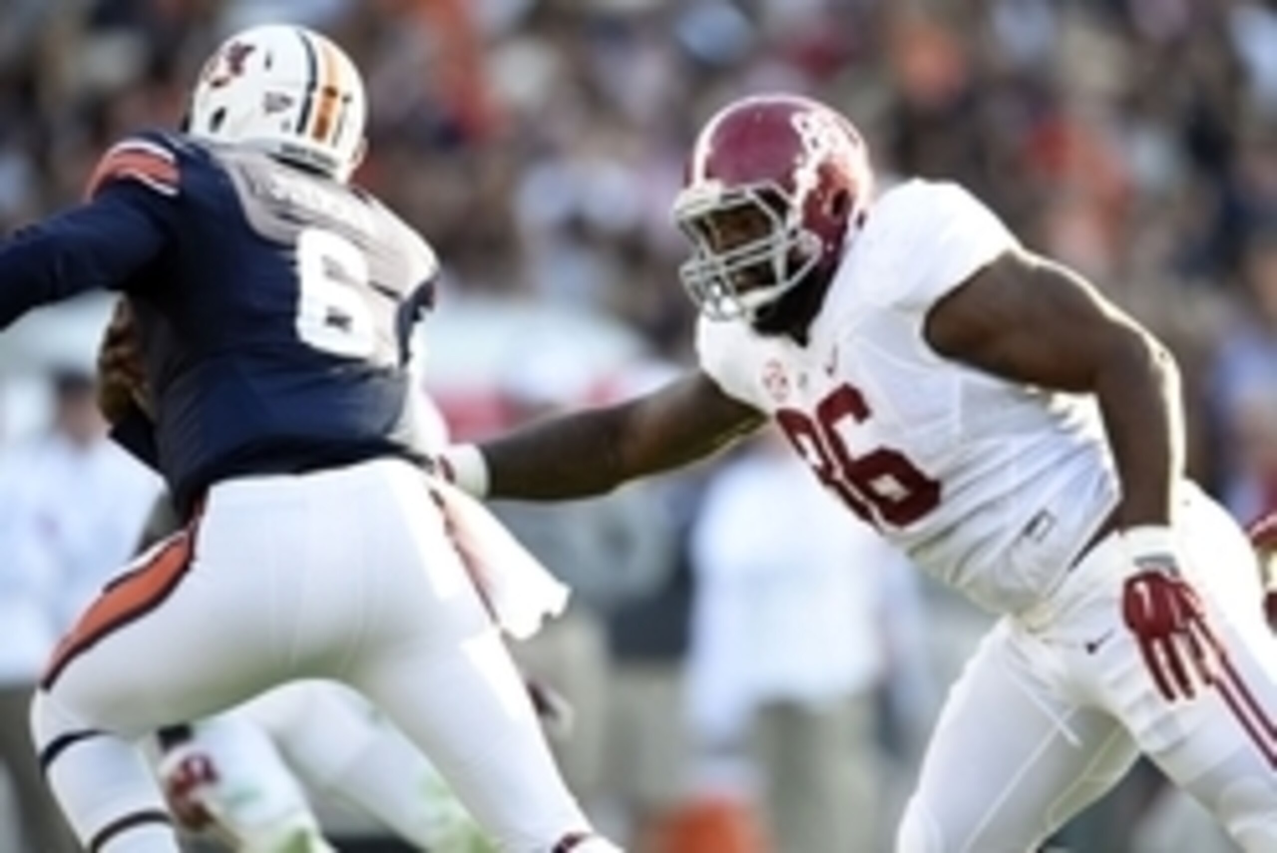 Nov 28, 2015; Auburn, AL, USA; Alabama Crimson Tide defensive lineman A'Shawn Robinson (86) chases Auburn Tigers quarterback Jeremy Johnson (6) at Jordan Hare Stadium. Mandatory Credit: RVR Photos-USA TODAY Sports