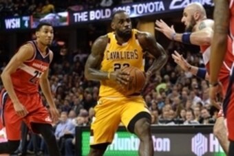 Dec 1, 2015; Cleveland, OH, USA; Cleveland Cavaliers forward LeBron James (23) dribbles the ball past Washington Wizards forward Otto Porter Jr. (22) during the third quarter at Quicken Loans Arena. The Wizards won 97-85. Mandatory Credit: Ken Blaze-USA T