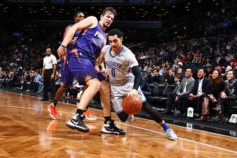 BROOKLYN, NY - DECEMBER 1: Shane Larkin #0 of the Brooklyn Nets drives to the basket against the Phoenix Suns during the game on December 1, 2015 at Barclays Center in Brooklyn, New York. NOTE TO USER: User expressly acknowledges and agrees that, by downl