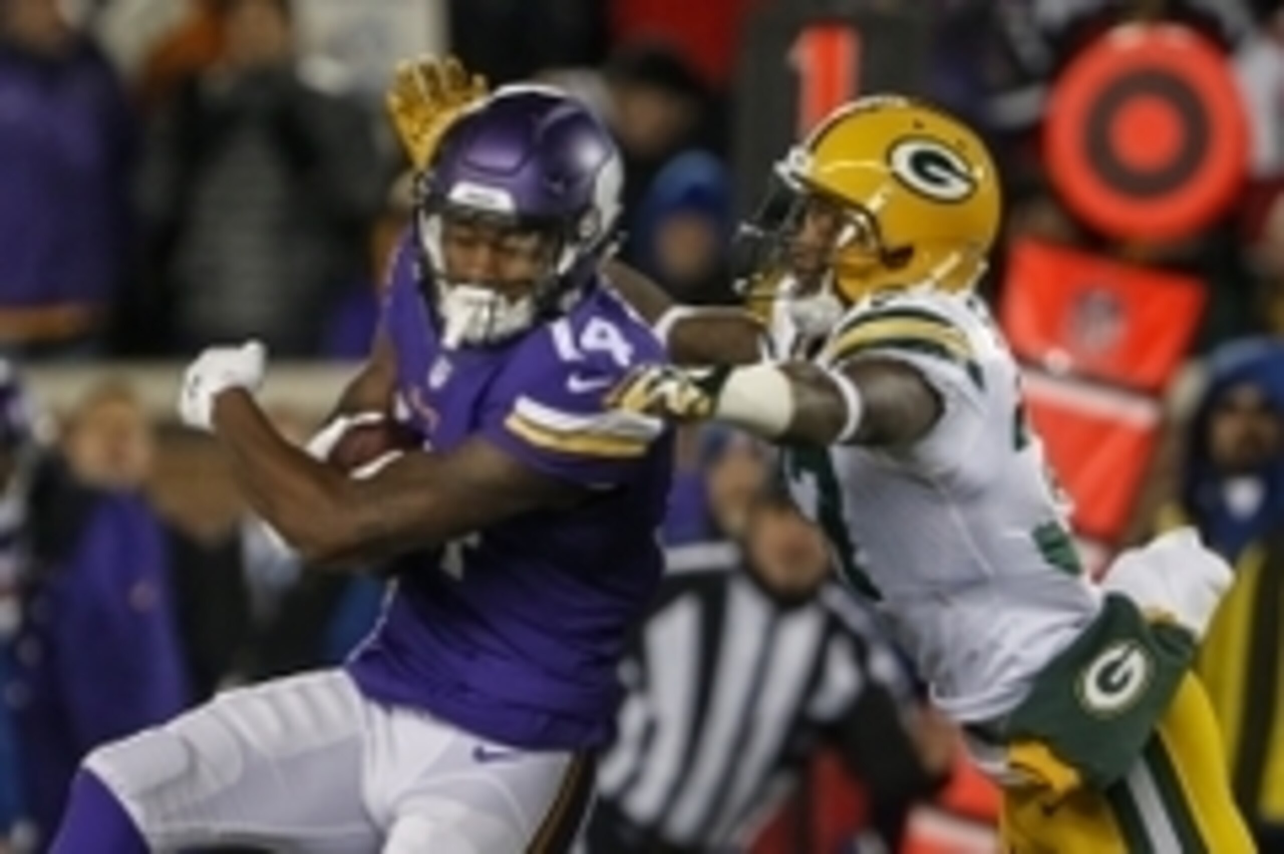 Nov 22, 2015; Minneapolis, MN, USA; Minnesota Vikings wide receiver Stefon Diggs (14) catches a pass as Green Bay Packers kicker Mason Crosby (2) defends hin in the third quarter at TCF Bank Stadium. The Packers win 30-13. Mandatory Credit: Bruce Kluckhoh