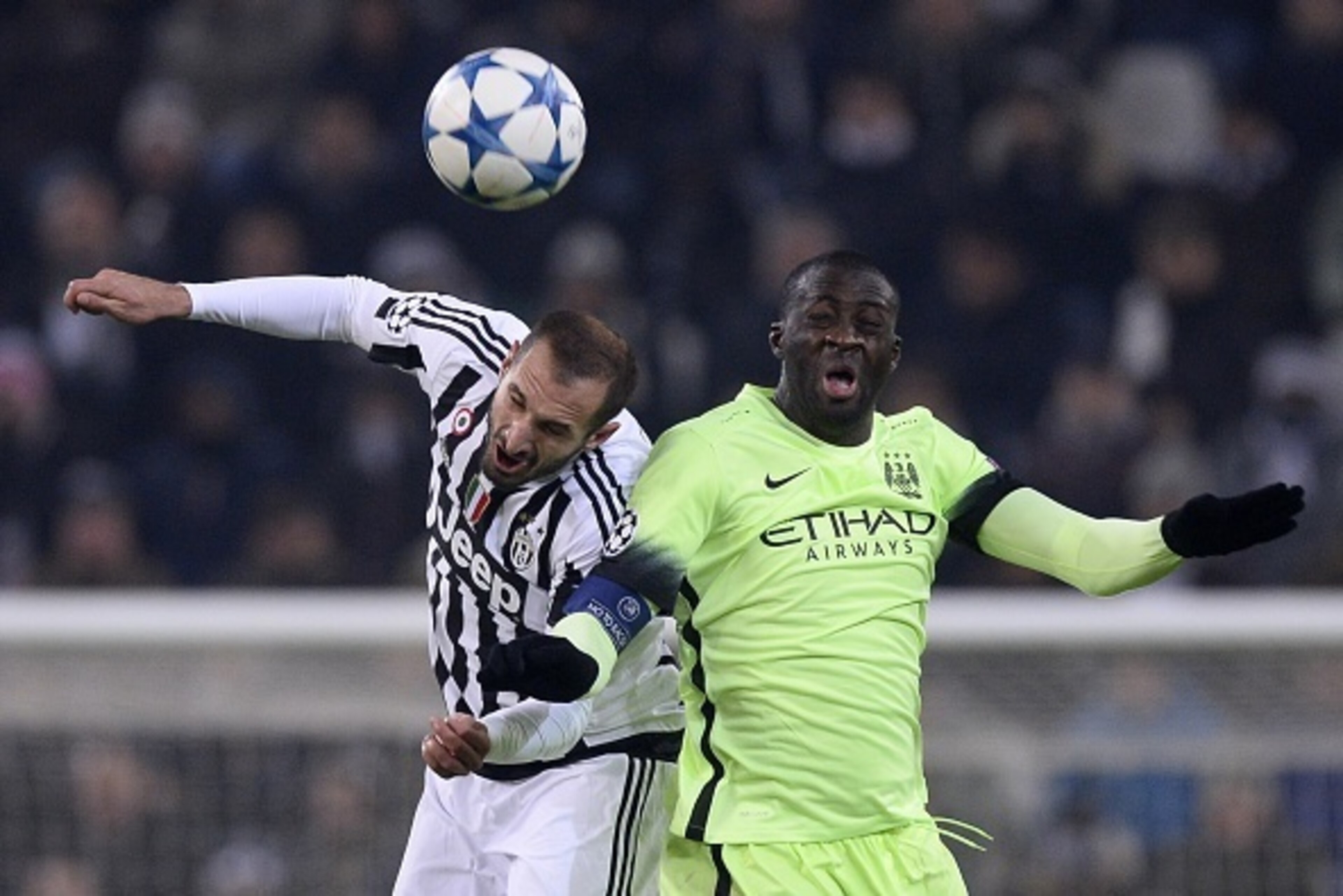 Juventus' defender from Italy Giorgio Chiellini (L) and Manchester City's Ivorian midfielder Yaya Toure fight for the ball during the UEFA Champions League football match Juventus vs Manchester City on November 25, 2015 at the Juventus Stadium in Turin.  