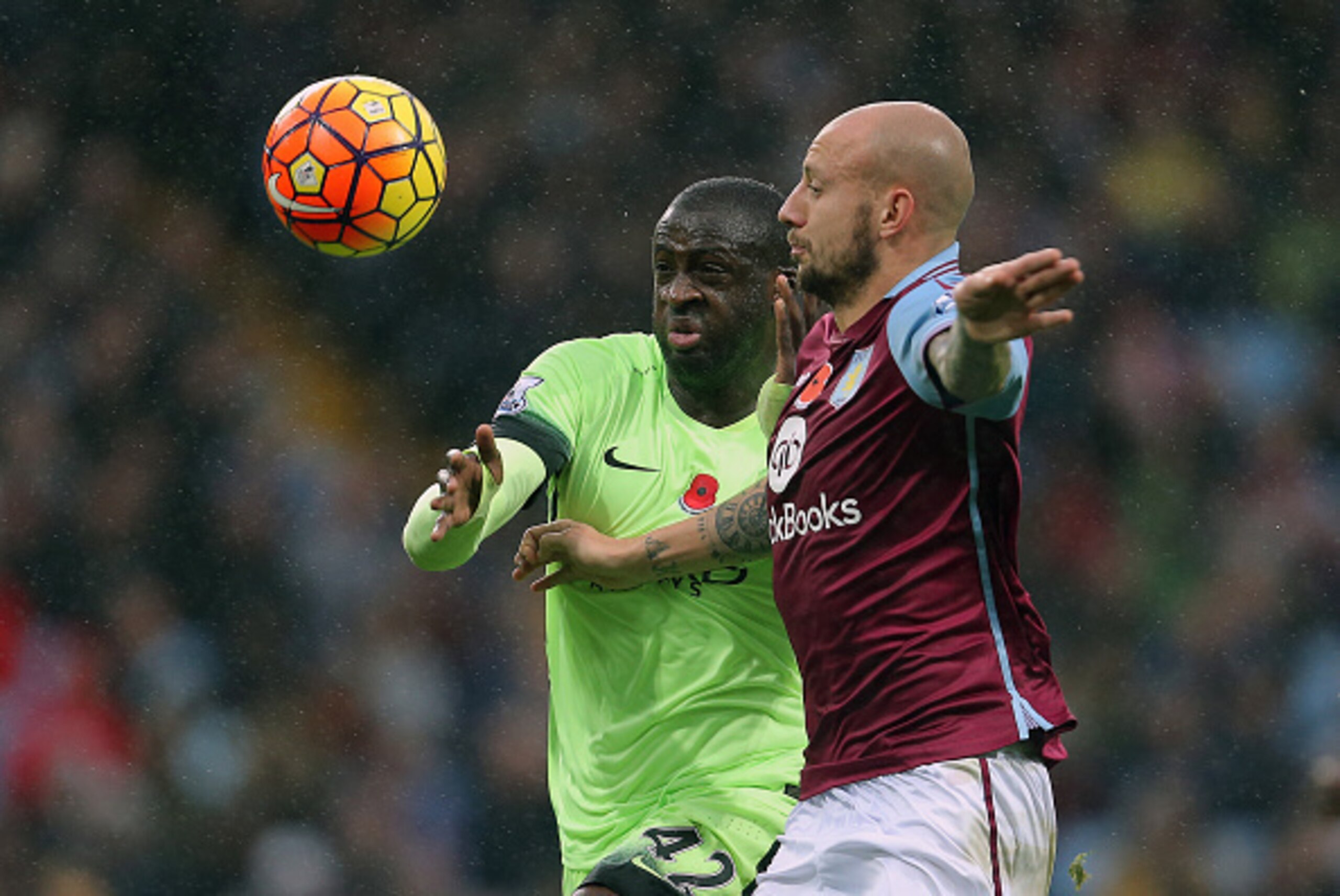 BIRMINGHAM, ENGLAND - NOVEMBER 08: Yaya Toure of Manchester City and Alan Hutton of Aston Villa during the Barclays Premier League match between Aston Villa and Manchester City at Villa Park on November 8, 2015 in Birmingham, England. (Phoyo by James Ba BIRMINGHAM, ENGLAND - NOVEMBER 08: Yaya Toure of Manchester City and Alan Hutton of Aston Villa during the Barclays Premier League match between Aston Villa and Manchester City at Villa Park on November 8, 2015 in Birmingham, England. (Phoyo by James Ba