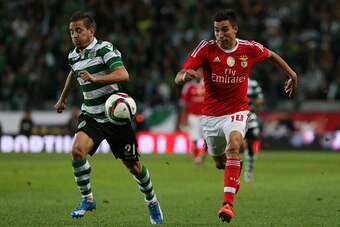 LISBON, PORTUGAL - NOVEMBER 21:  SL Benfica's midfielder Nico Gaitan with Sporting CP's defender Joao Pereira in action during the Taca de Portugal match between Sporting CP and SL Benfica at Estadio Jose Alvalade on November 21, 2015 in Lisbon, Portugal.