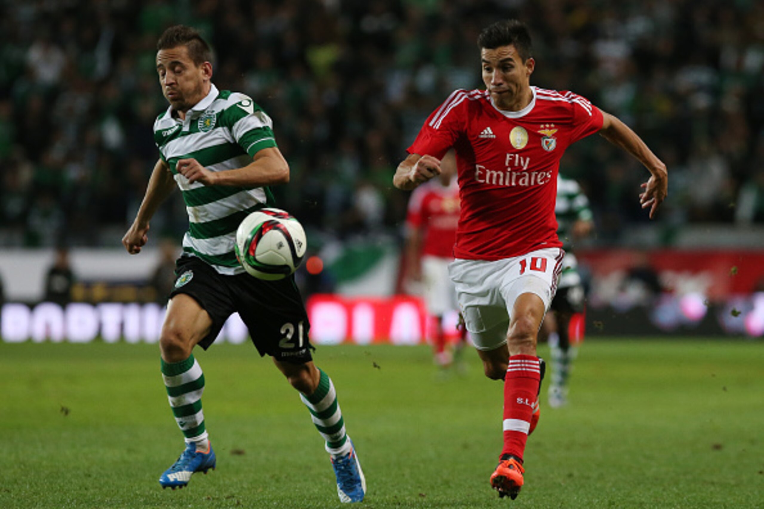 LISBON, PORTUGAL - NOVEMBER 21:  SL Benfica's midfielder Nico Gaitan with Sporting CP's defender Joao Pereira in action during the Taca de Portugal match between Sporting CP and SL Benfica at Estadio Jose Alvalade on November 21, 2015 in Lisbon, Portugal.