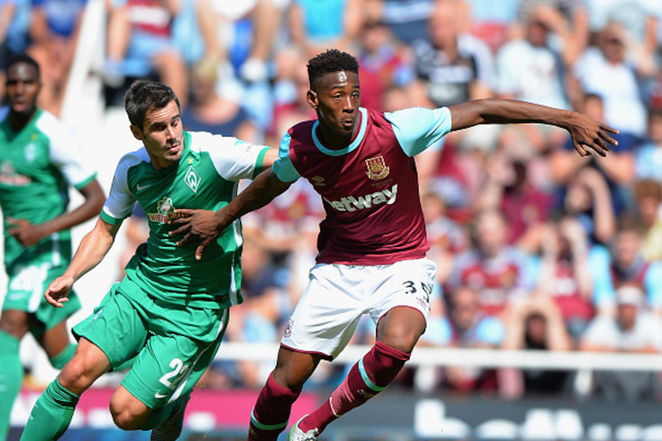 LONDON, ENGLAND - AUGUST 02:  Reece Oxford of West Ham United is tackled by Fin Bartels of SV Werder Bremen during the Betway Cup match between West Ham Utd and SV Werder Bremen at Boleyn Ground on August 2, 2015 in London, England.  (Photo by Tony Marsha