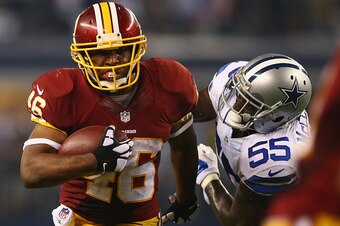 ARLINGTON, TX - OCTOBER 27:  Alfred Morris #46 of the Washington Redskins runs the ball against  Rolando McClain #55 of the Dallas Cowboys at AT&T Stadium on October 27, 2014 in Arlington, Texas.  (Photo by Ronald Martinez/Getty Images)