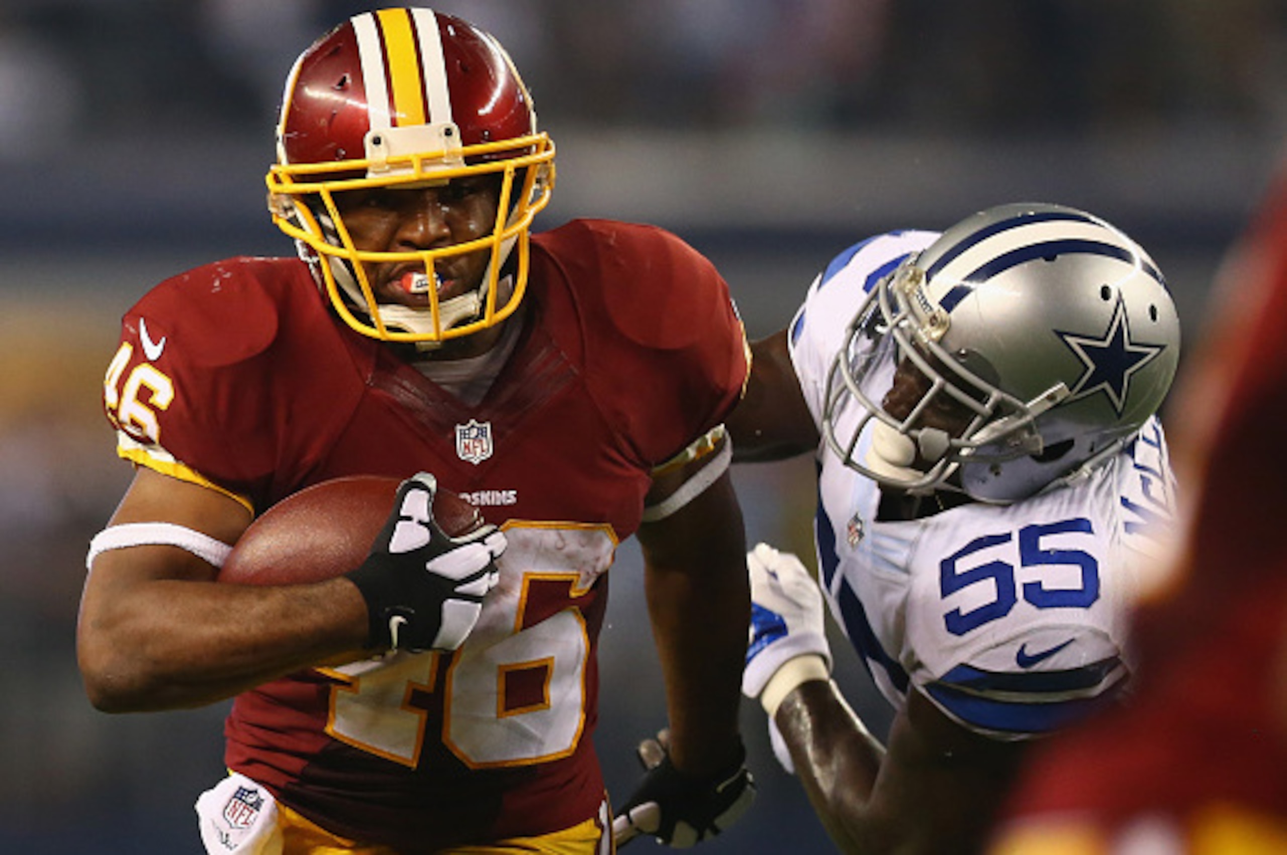 ARLINGTON, TX - OCTOBER 27:  Alfred Morris #46 of the Washington Redskins runs the ball against  Rolando McClain #55 of the Dallas Cowboys at AT&T Stadium on October 27, 2014 in Arlington, Texas.  (Photo by Ronald Martinez/Getty Images)