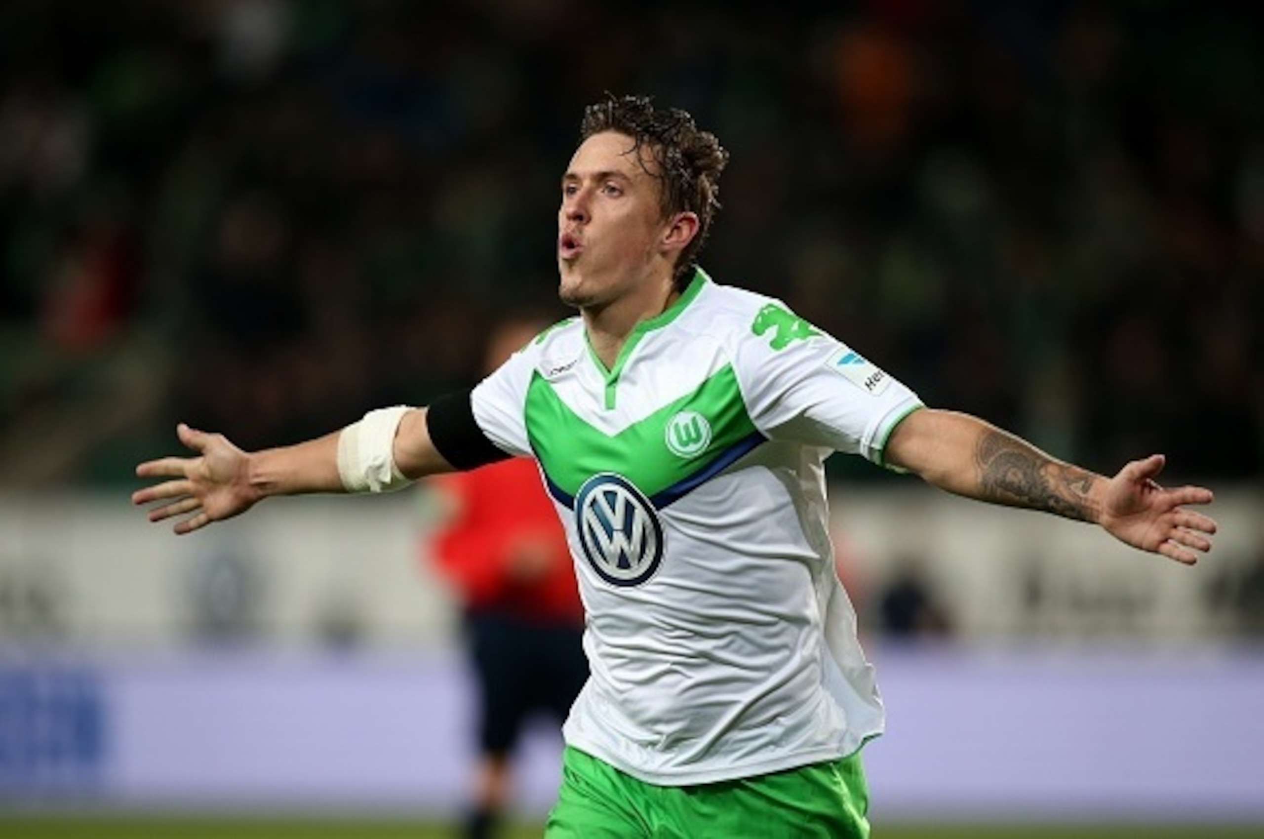 Wolfsburg's striker Max Kruse celebrates after scoring the 6-0 during the German first division Bundesliga football match VfL Wolfsburg vs Werder Bremen in Wolfsburg, northern Germany, on November 21, 2015.  AFP PHOTO / RONNY HARTMANN

RESTRICTIONS: DURIN