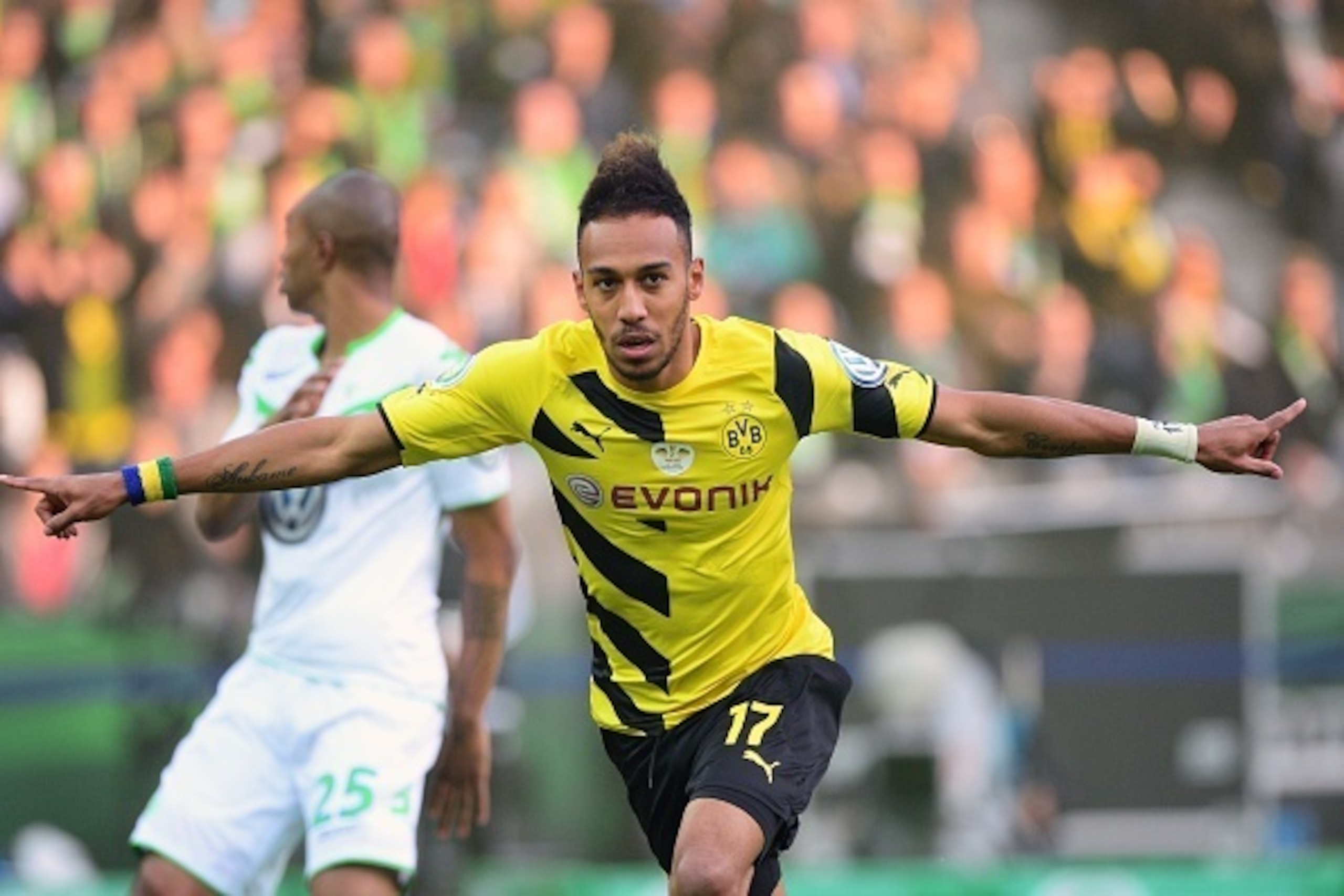 Dortmund's Gabonese striker Pierre-Emerick Aubameyang celebrates scoring during the German Cup DFB Pokal final football match between BVB Borussia Dortmund and VfL Wolfsburg at the Olympic Stadium in Berlin on May 30, 2015.  AFP PHOTO / JOHN MACDOUGALL   